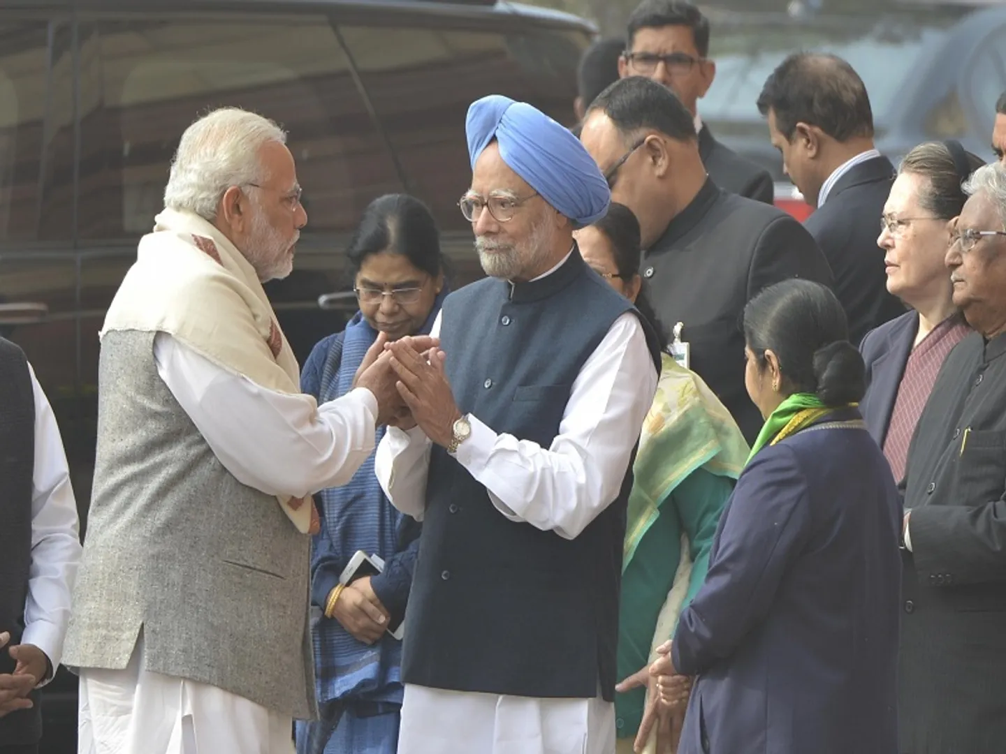 New Delhi: Prime Minister Narendra Modi greets his predecessor Manmohan Singh as they arrive to pay tributes to the martyrs of 2001 Parliament attack in New Delhi on Dec 13, 2017. (File Photo: IANS)