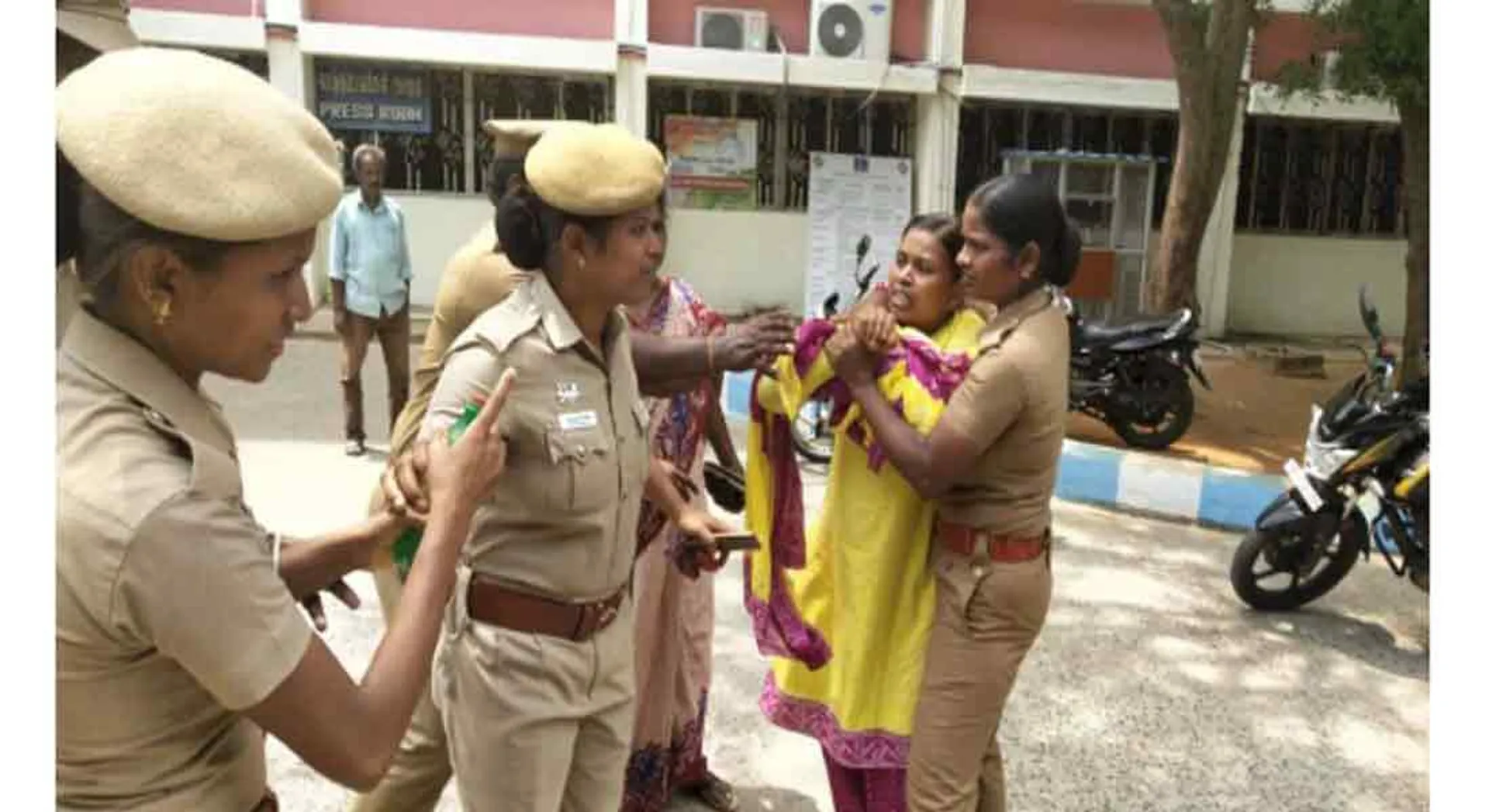   women tried to fire in front of Collector's office