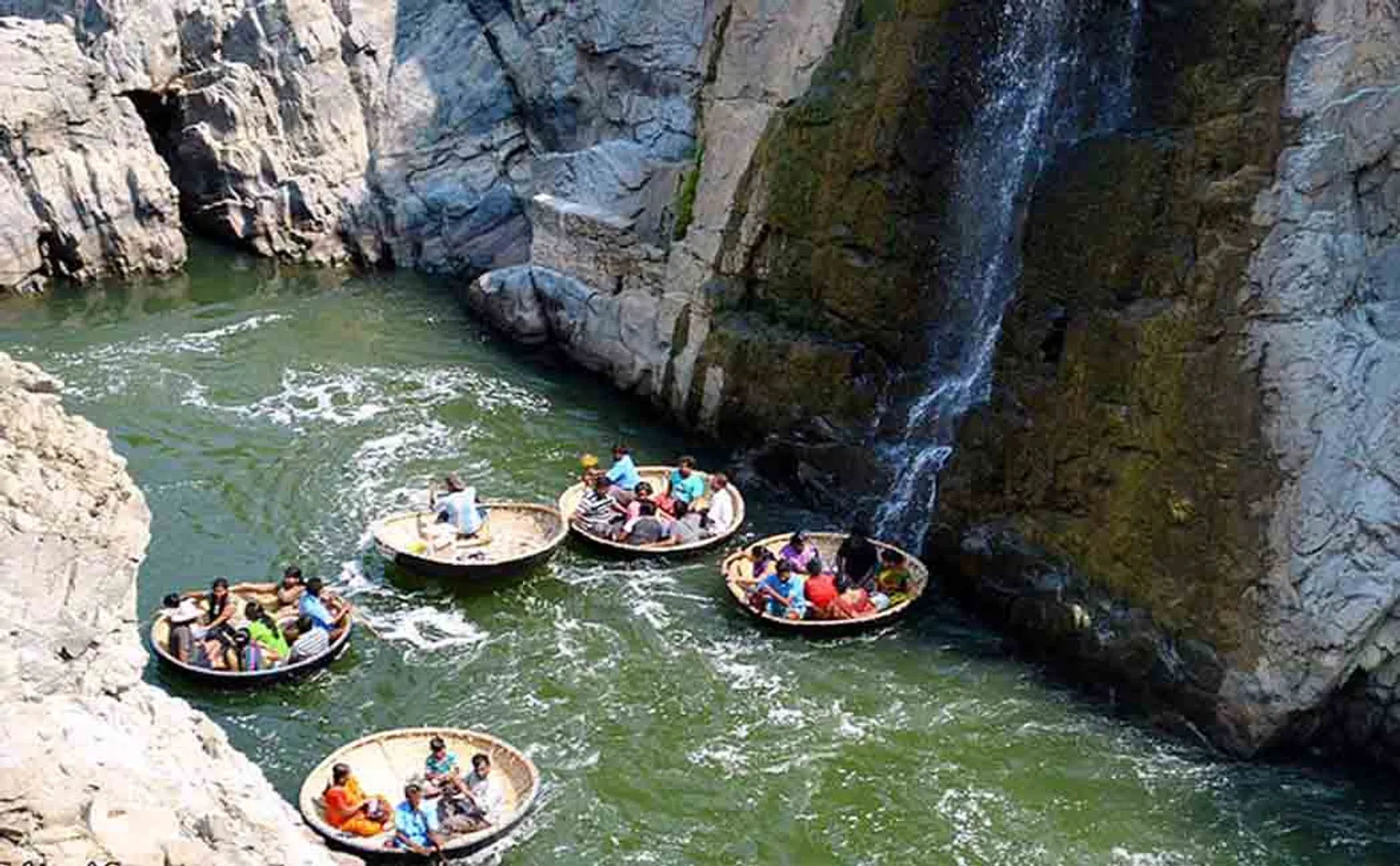 HOGENAKKAL WATER FALLS DOWN CONTINUE BOAT SERVICE TOURIST PEOPLES HAPPY