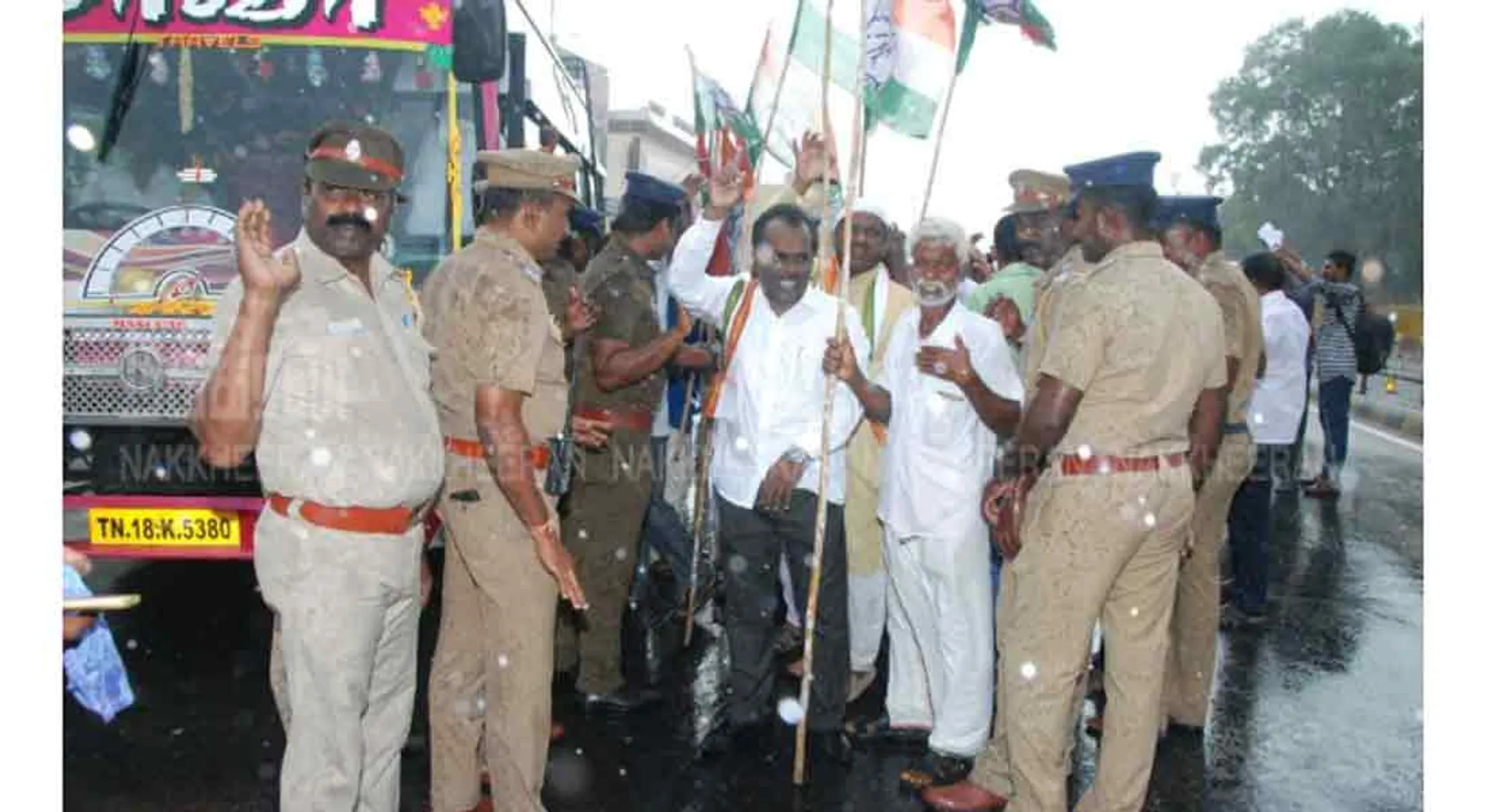 Congress protest in the rain condemning arrest Chidambaram