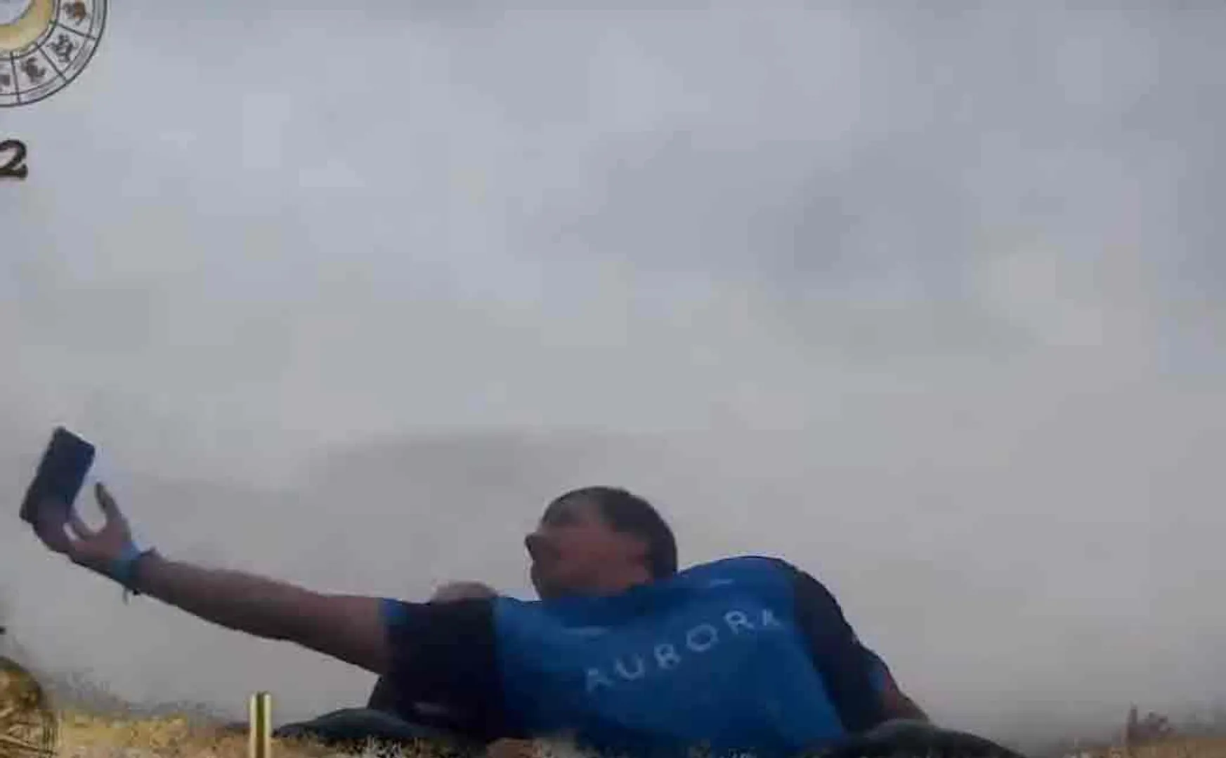 man catches phone in roller coaster