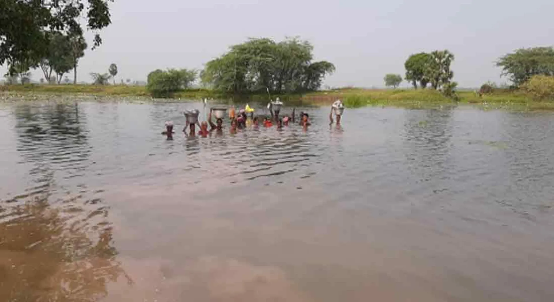  Civilians swimming in lake for agricultural work