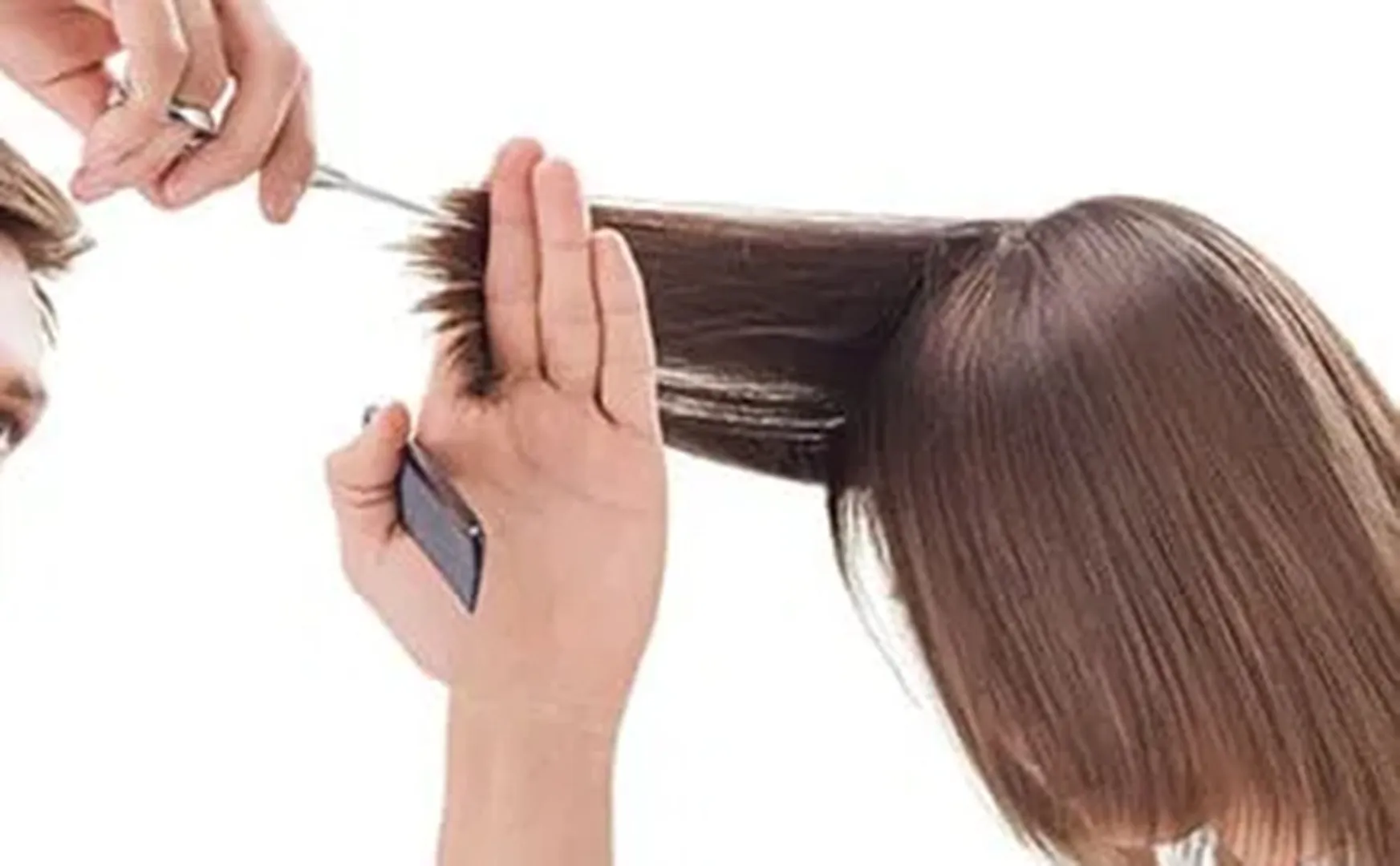 Husband cutting his wife's hair 