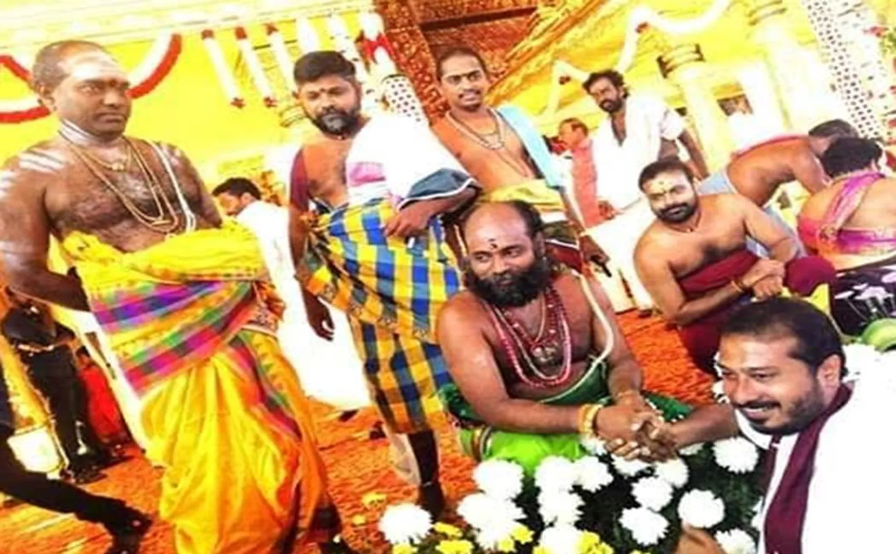  jai anand wedding function - two religious celebrities shaking hands