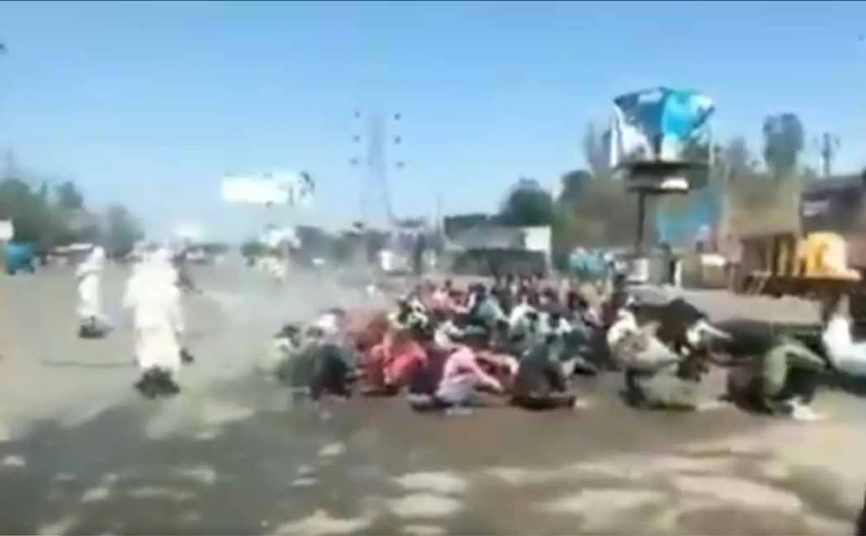 Mass migrants labours are disinfected by spraying sanitizer in Uttar Pradesh