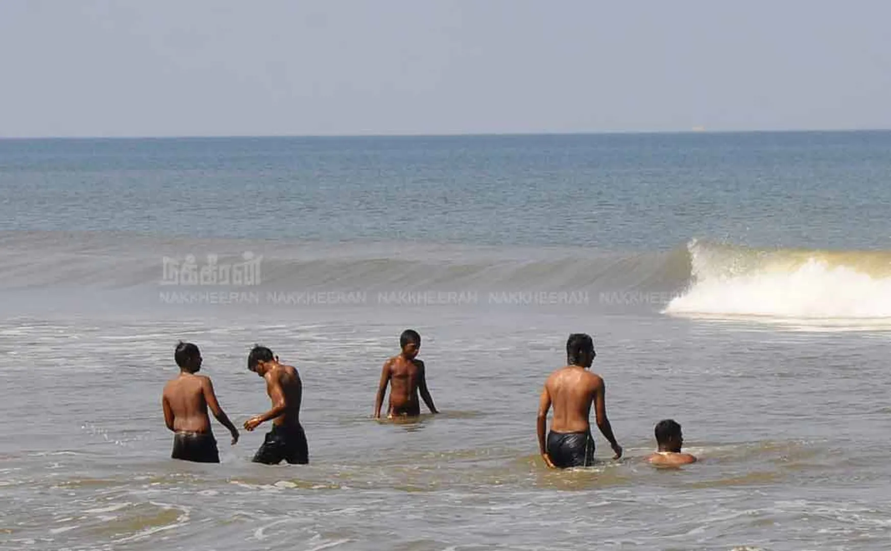 People playing on the beach during curfew