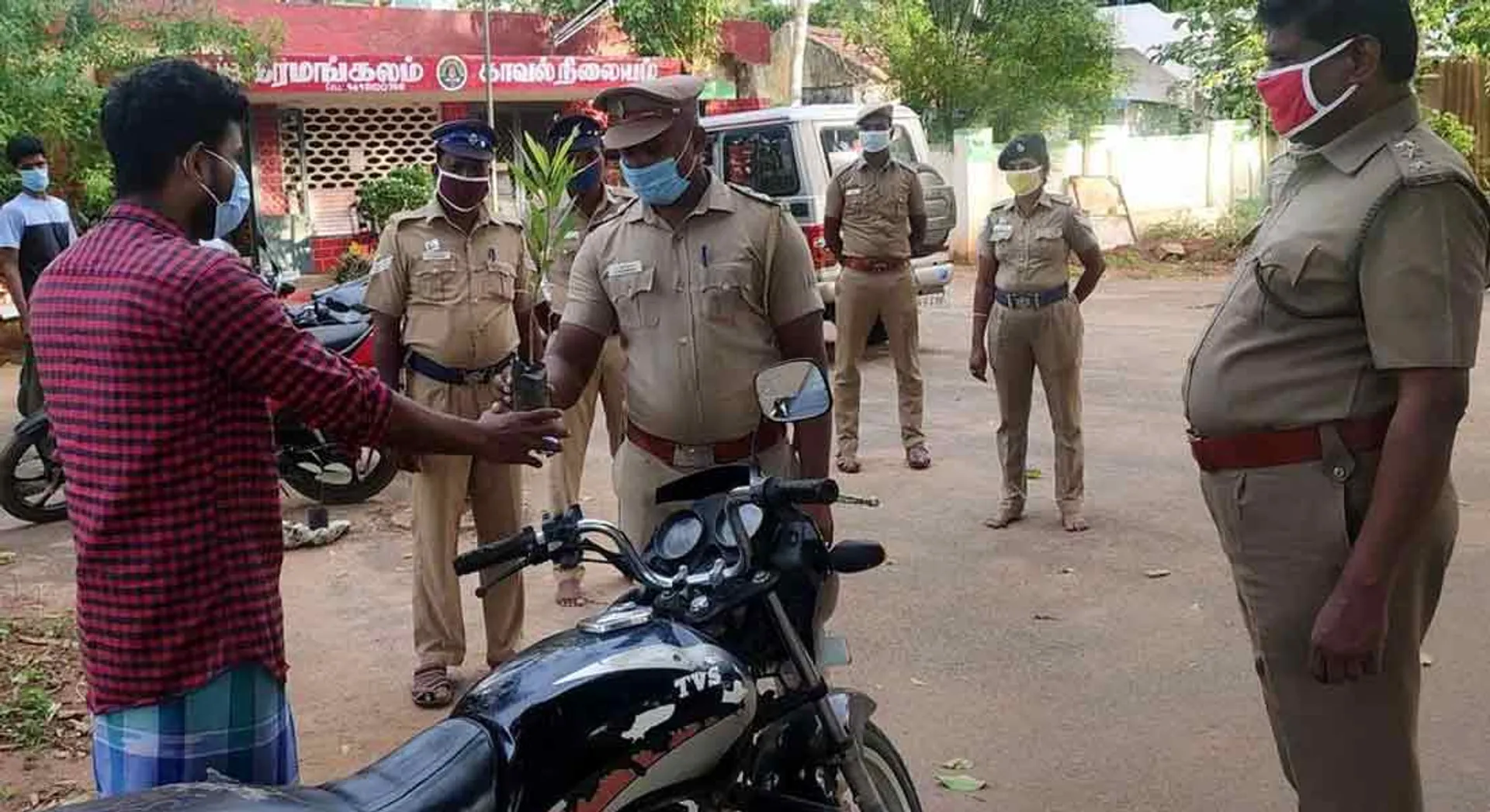  Young people on a bike without a face mask...The cop who told him to grow tree
