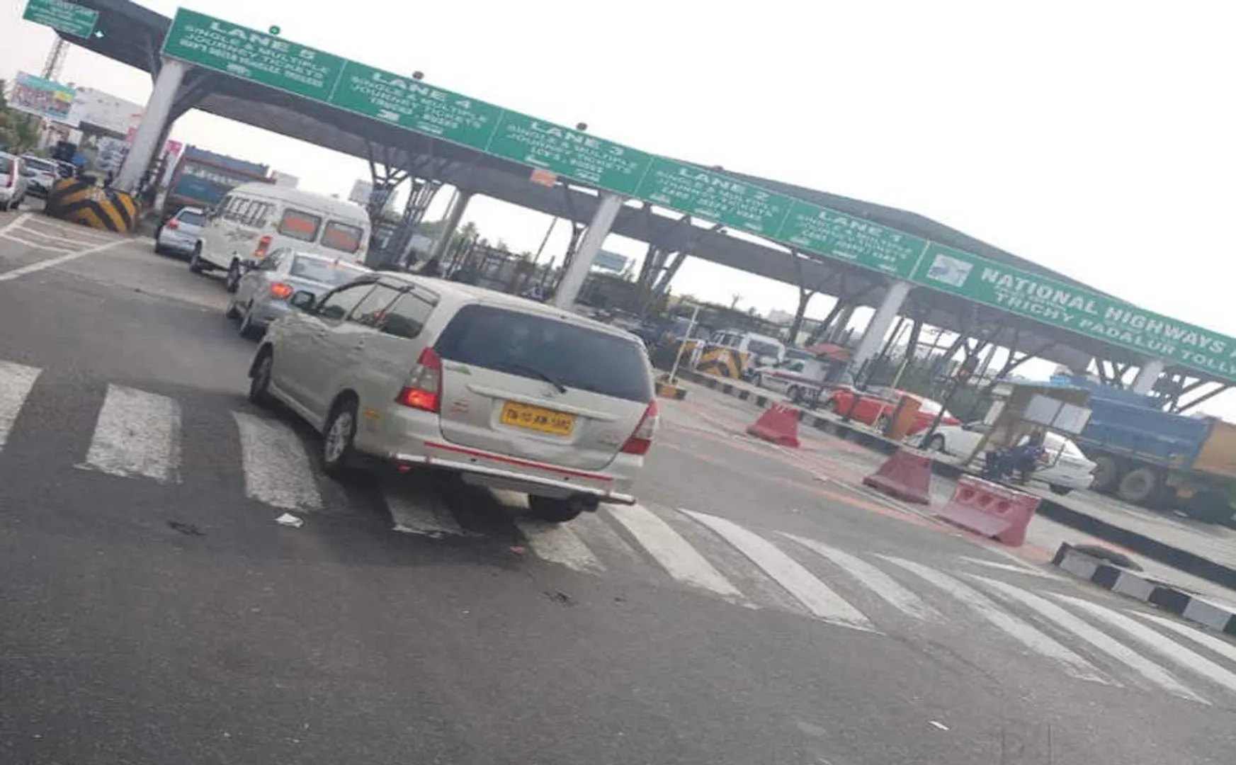 Government bus -tollgate-Passengers- helped- by -Own money