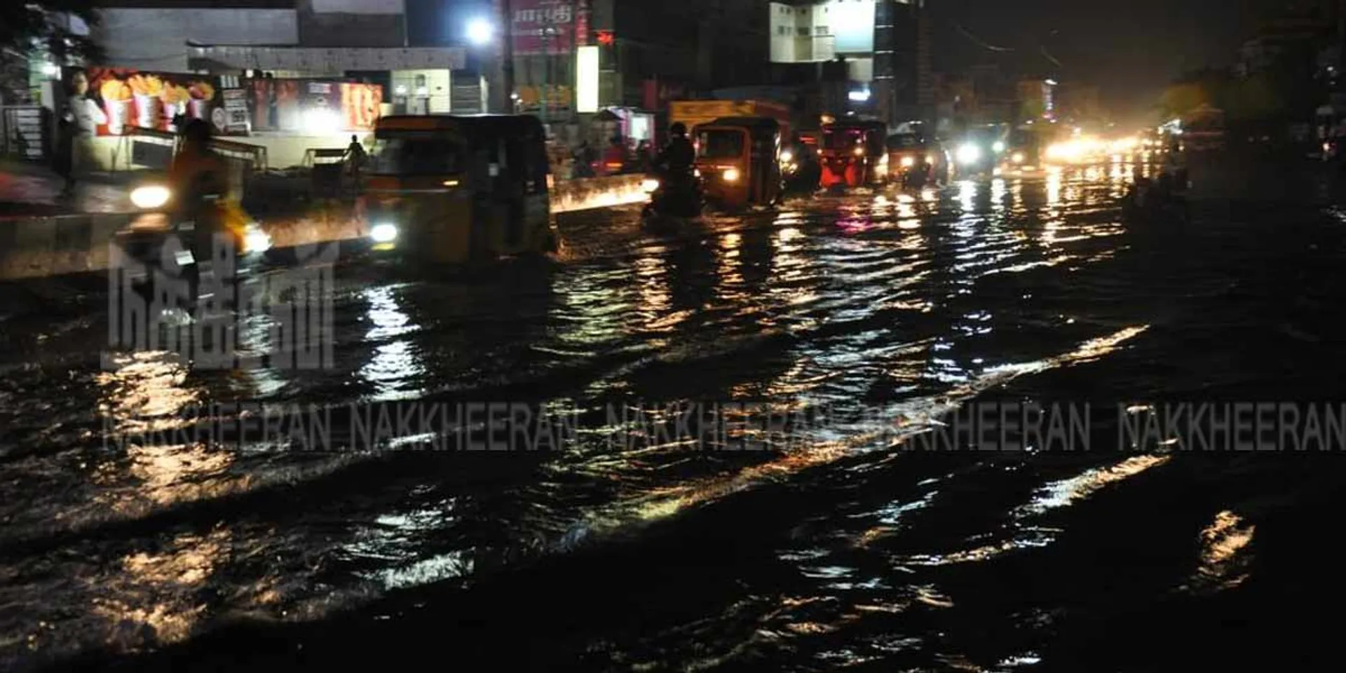 Rainwater running down the road like a river on a redhills (Pictures)