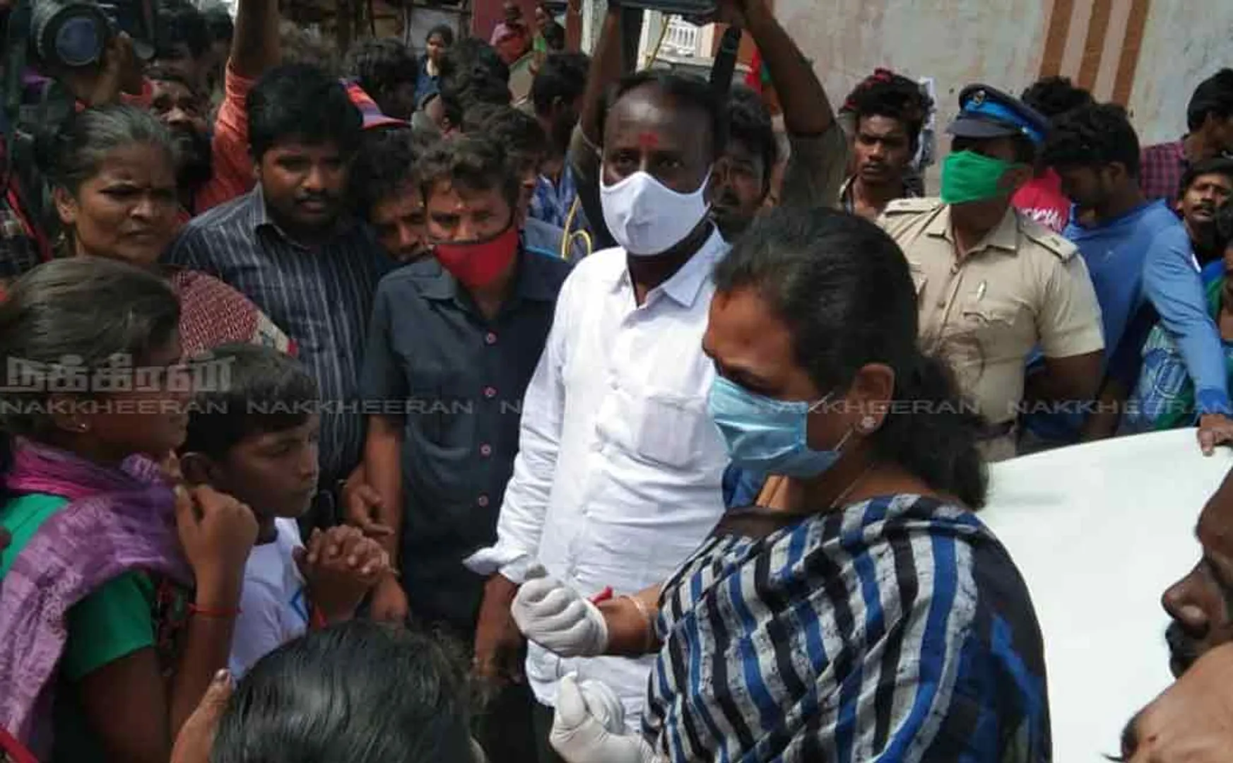 Premalatha Vijayakandh met the people at the Chemmancheri fisherman's residence and distributed food items