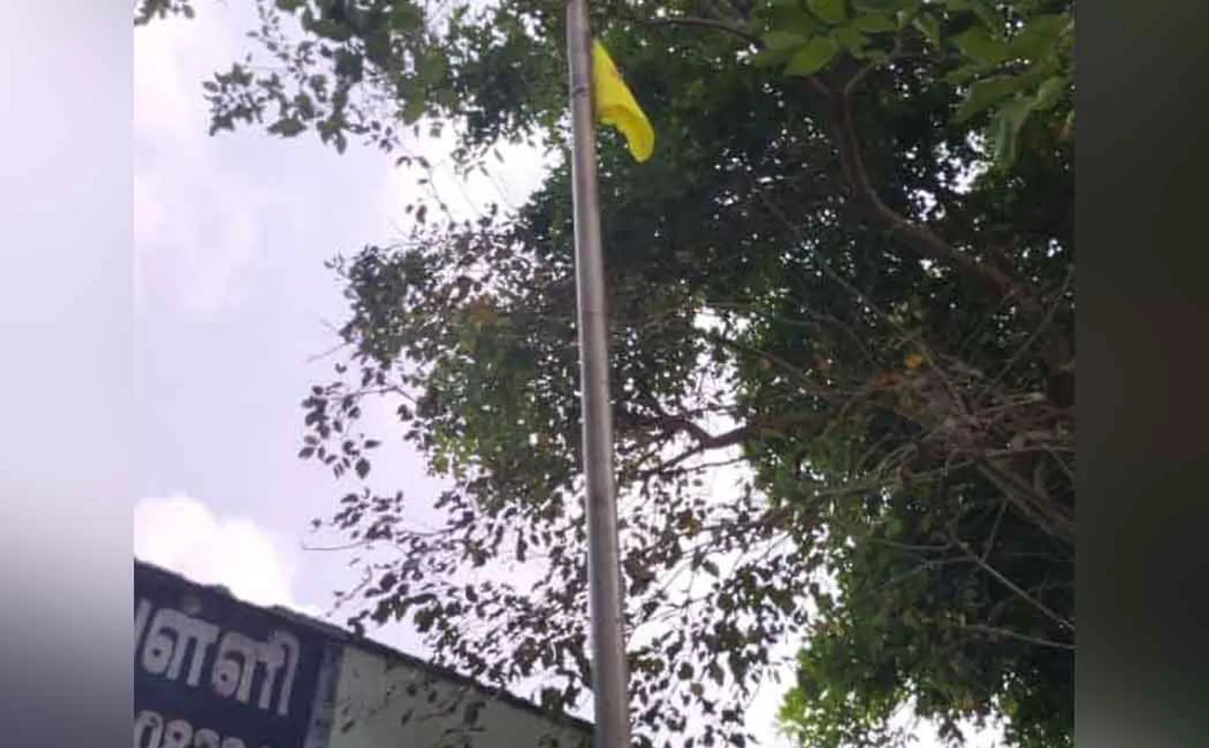 Vanniyar Sangam flag on the national flag pole in Kaattumannarkovil government school 
