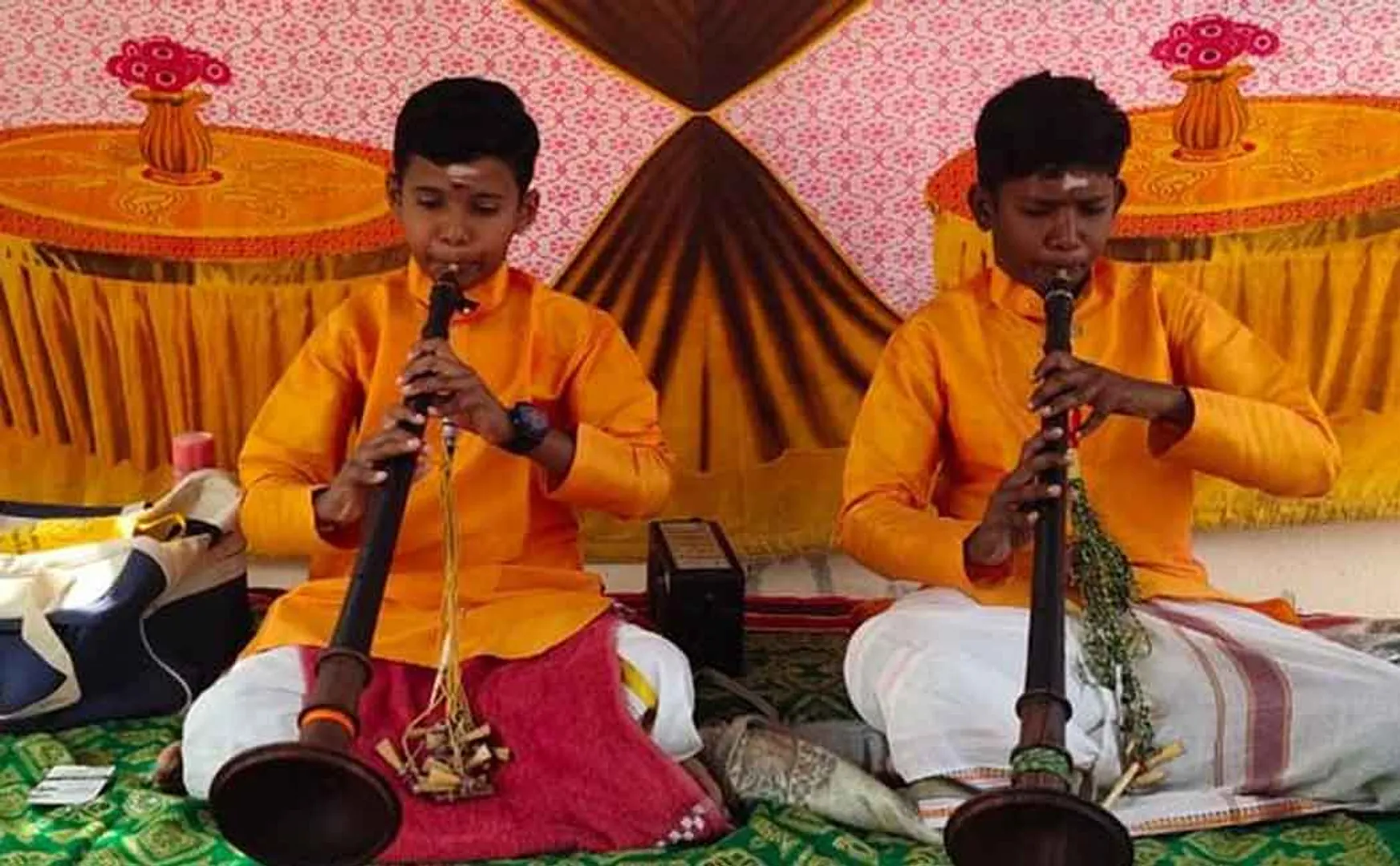 Boys who played Nataswaram Minister presents gifts 