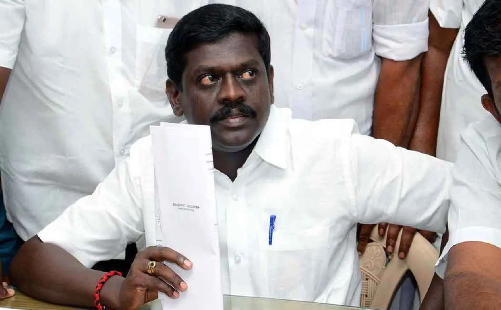dmk district secretary complains admk MLA's wife to elction commission