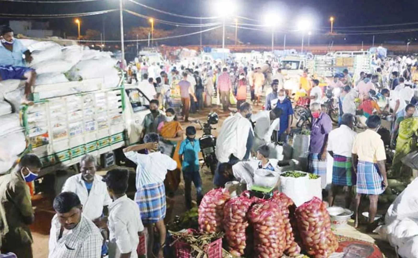 Traders protest by pouring vegetables on the road condemning the change in the vegetable market