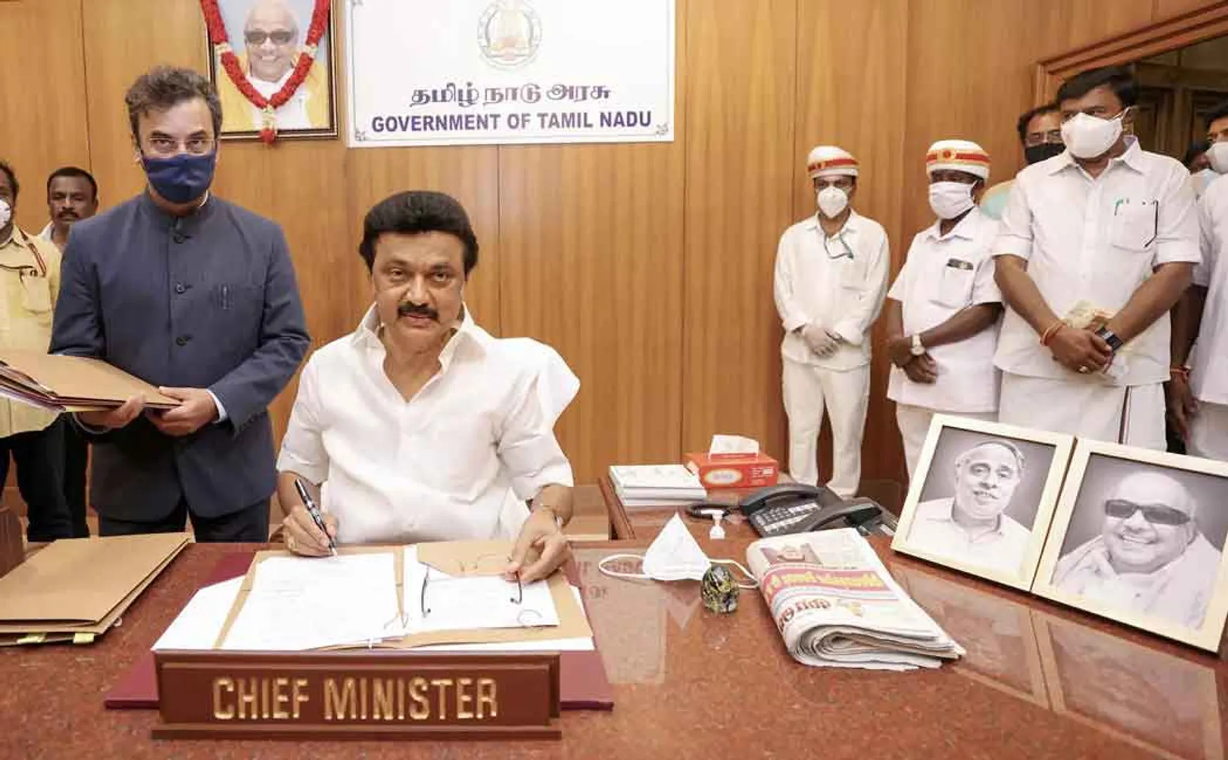 AIADMK leader pasting a poster congratulating MK Stalin