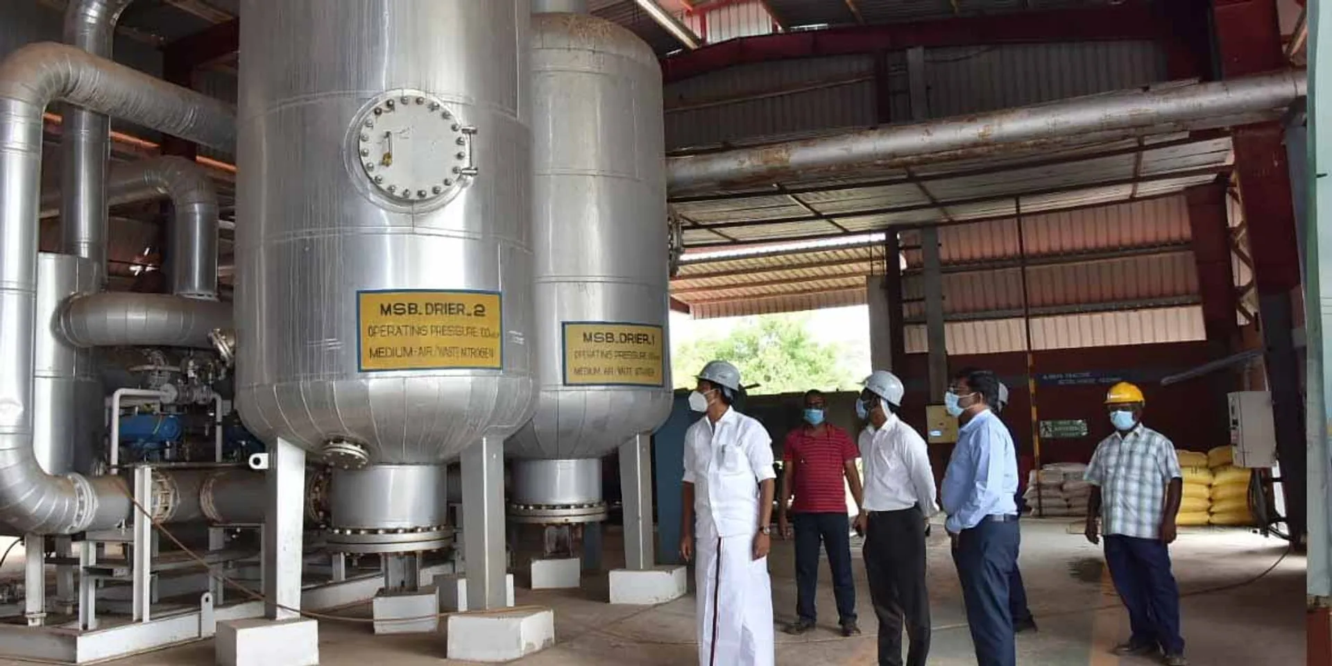 Minister Anbil Mahesh who inspected the oxygen production company