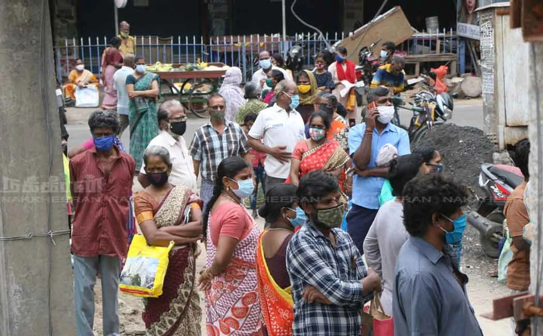 People waiting in line at ration shop
