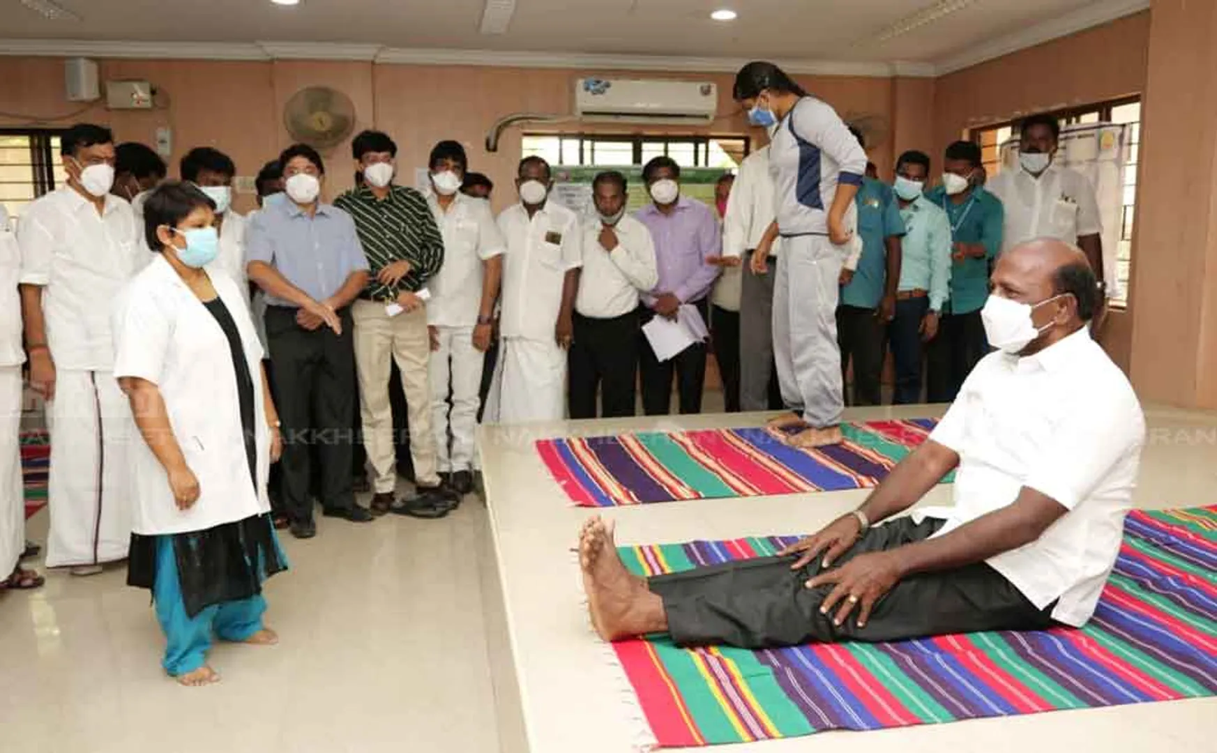 The minister who did yoga following the field visit 