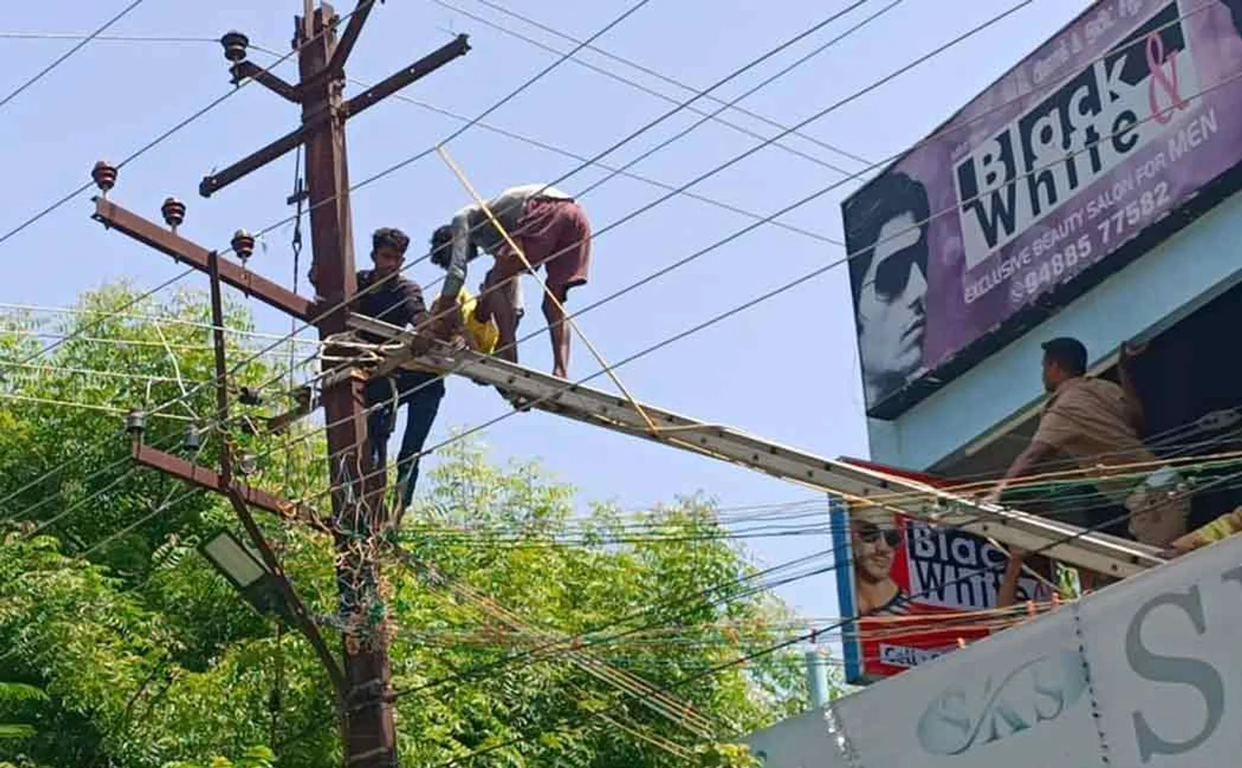 Two people working on a power pole were injured in an electric shock  