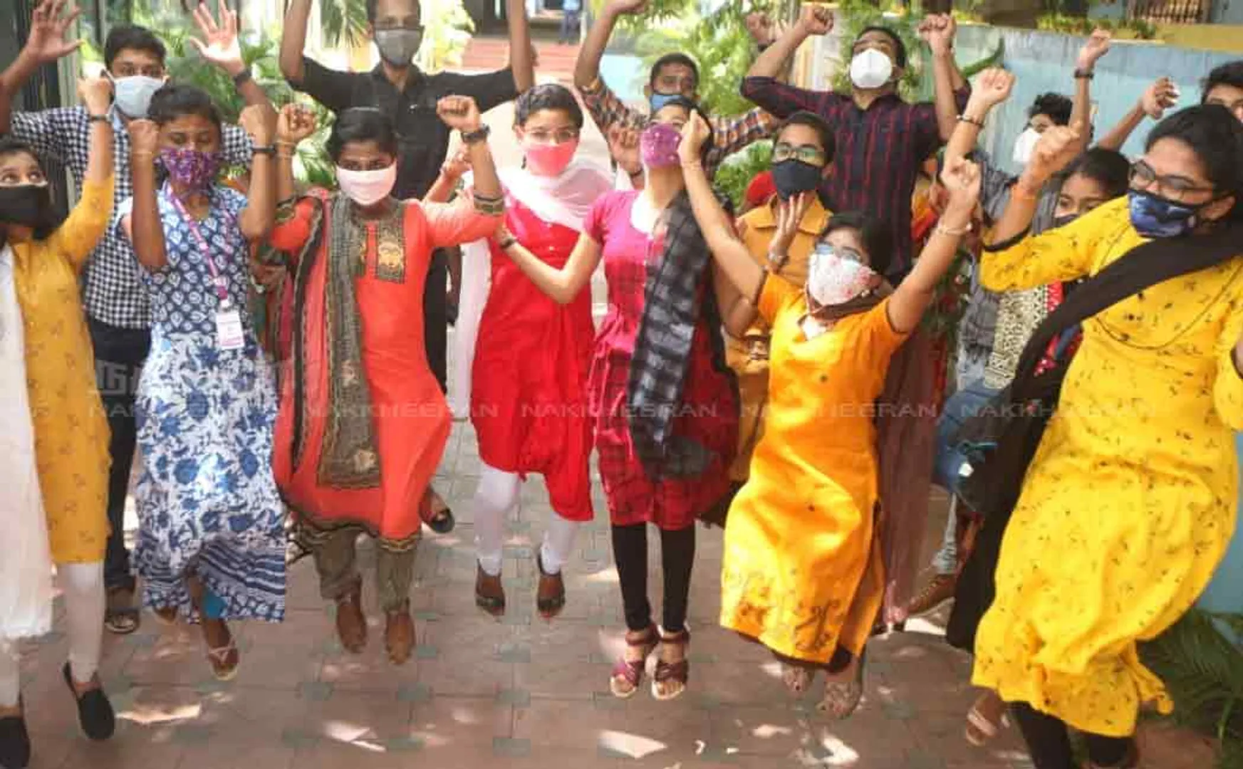 +2 exam success; Students jumping for joy