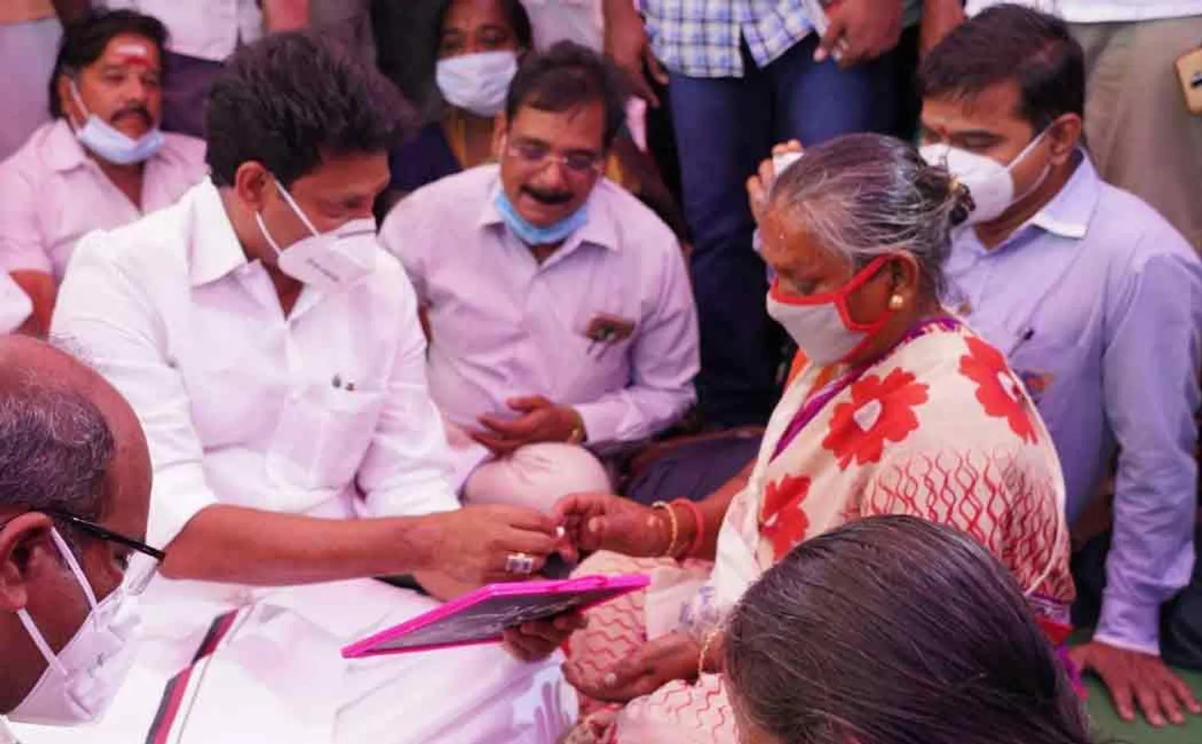 Minister Anbil Mahesh who taught the elders to hold hands and write ..!