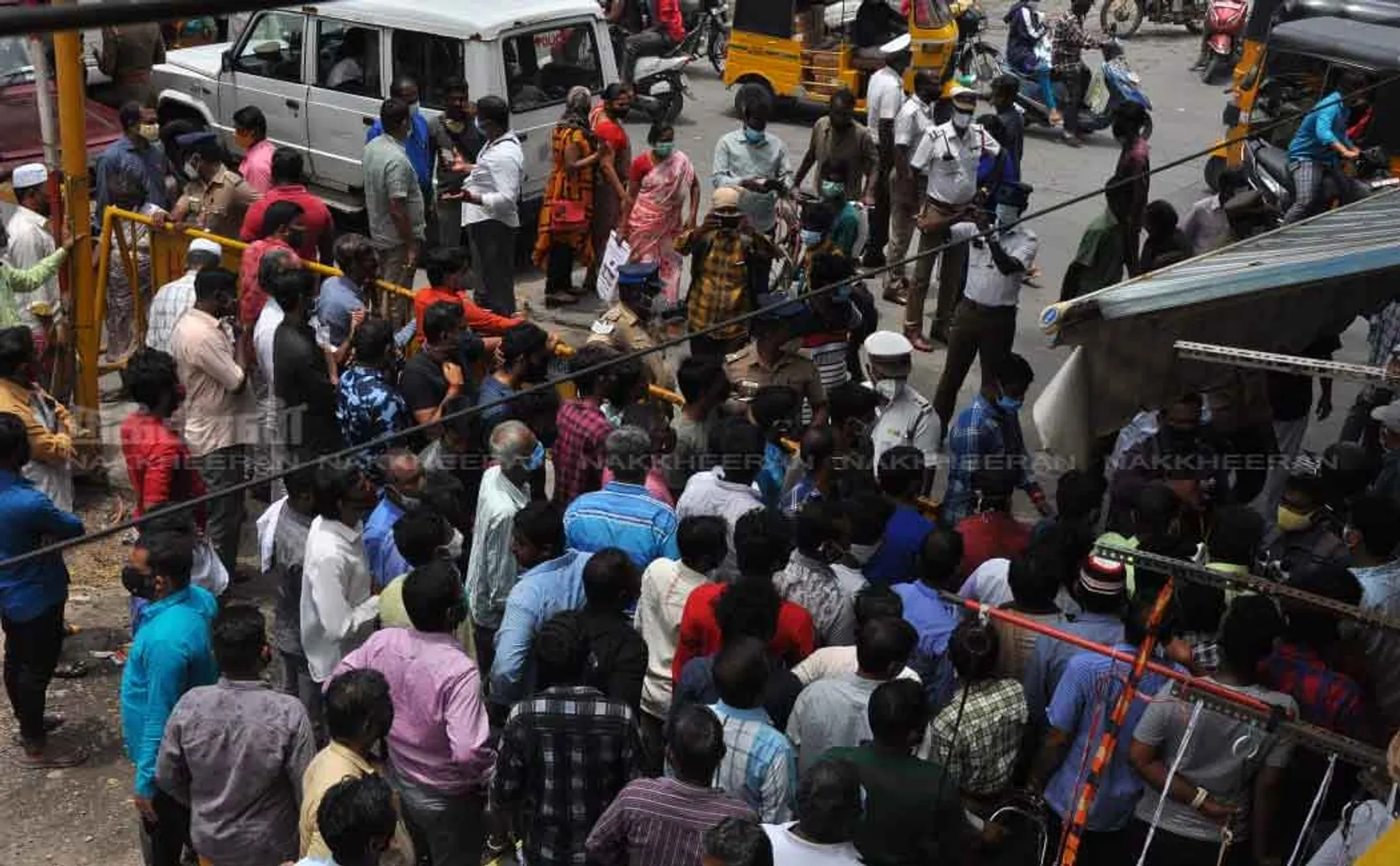 Merchants block the road to open shops 