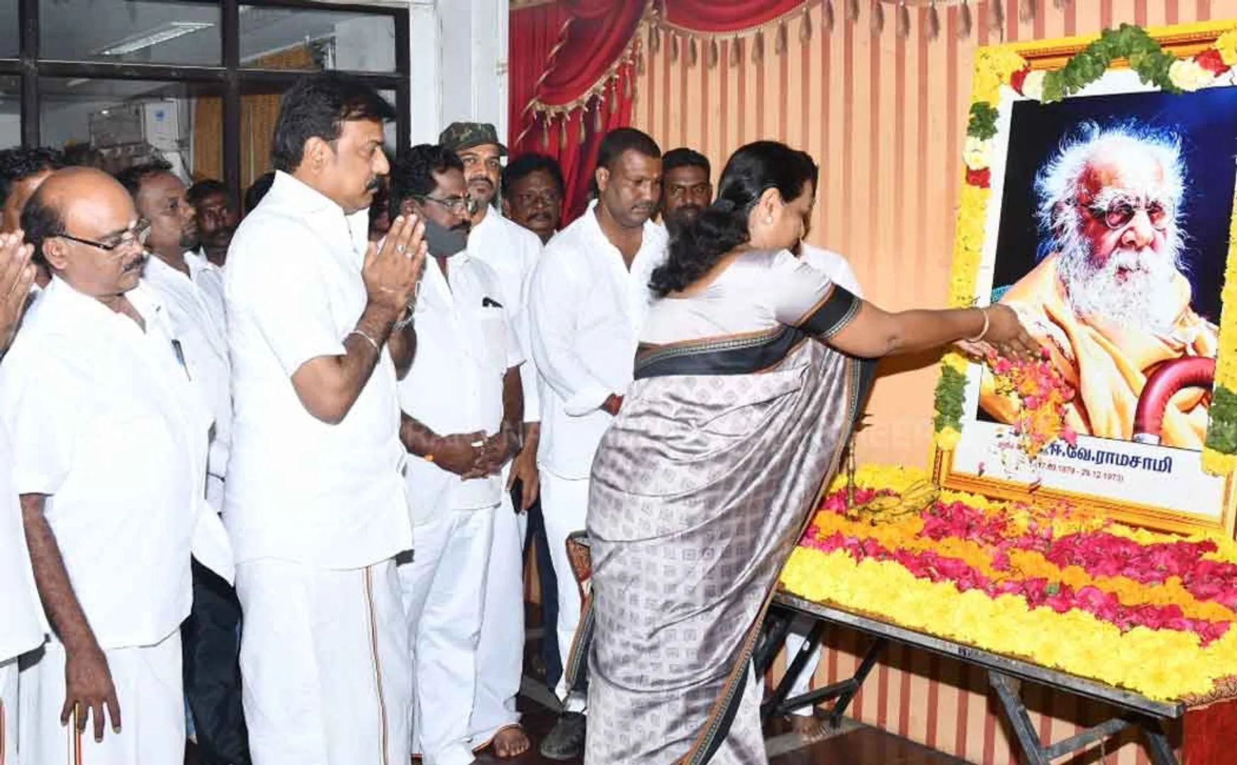 Premalatha Vijayakand pays floral tributes to Periyar portrait