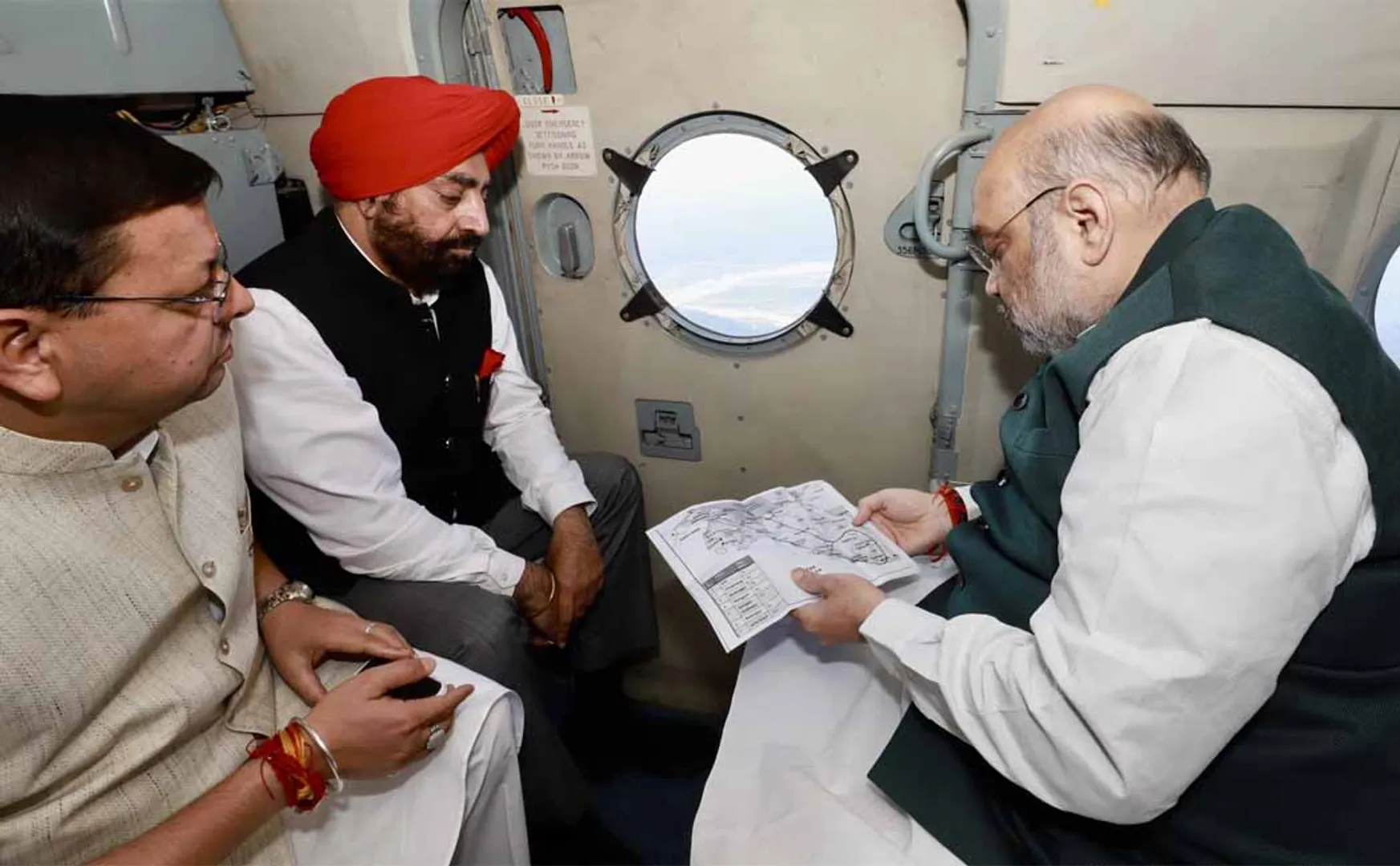 Amitsha inspecting flood-affected areas by helicopter
