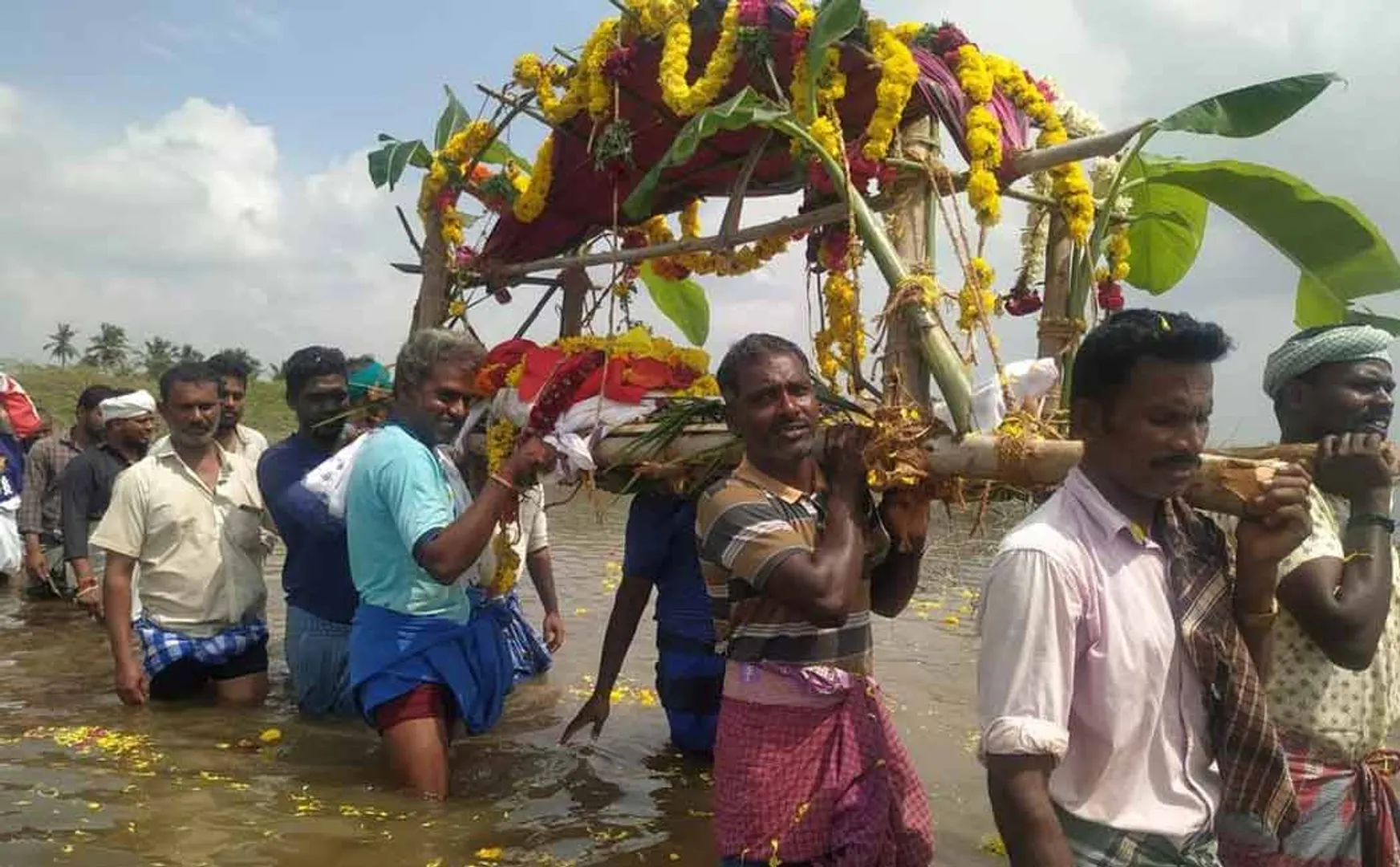 Shame on carrying a corpse in waist-deep water!