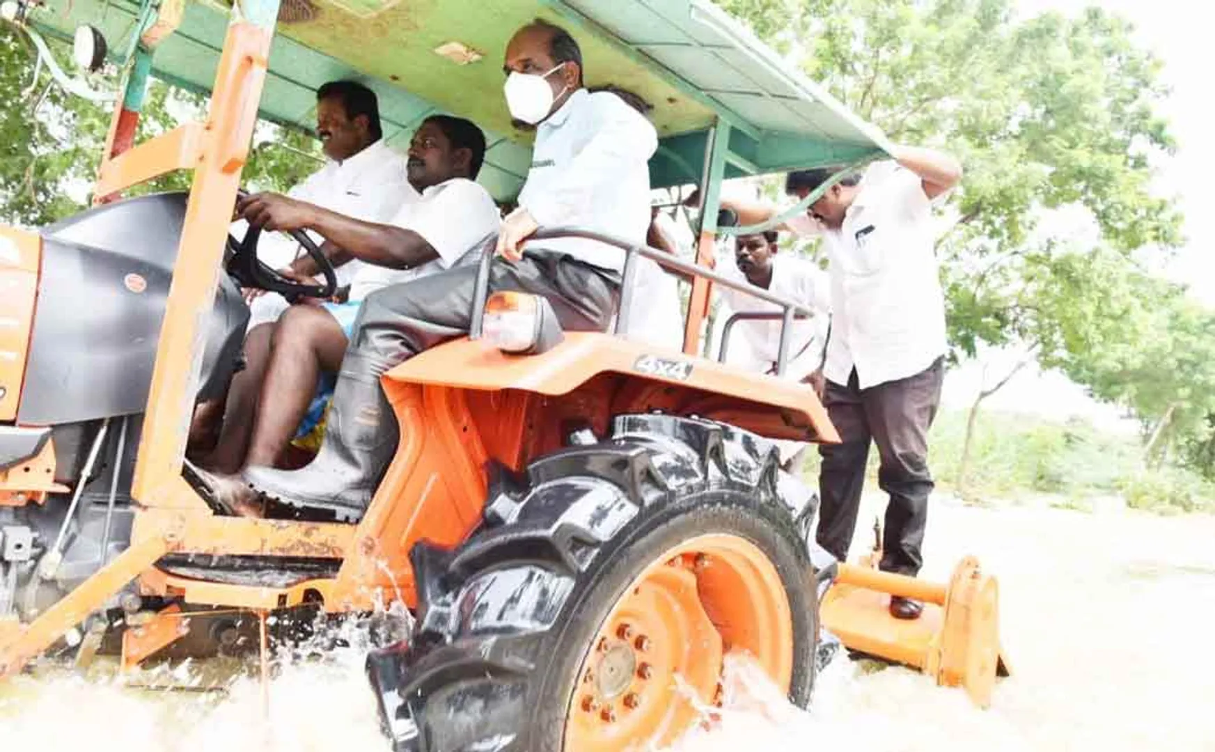 District Collector travels by tractor
