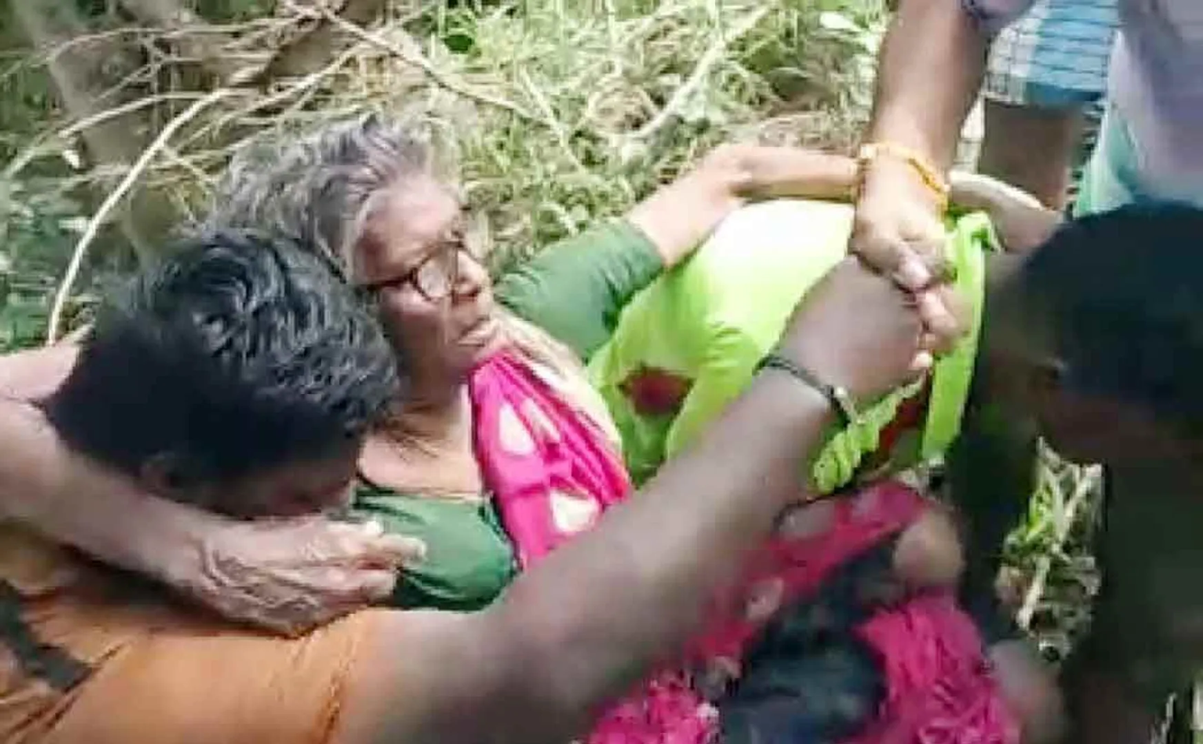 Firefighters rescue elderly woman trapped in floodwaters