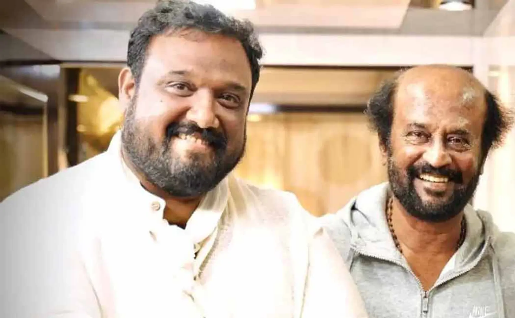 actor rajinikanth presented gold chain to director siva 