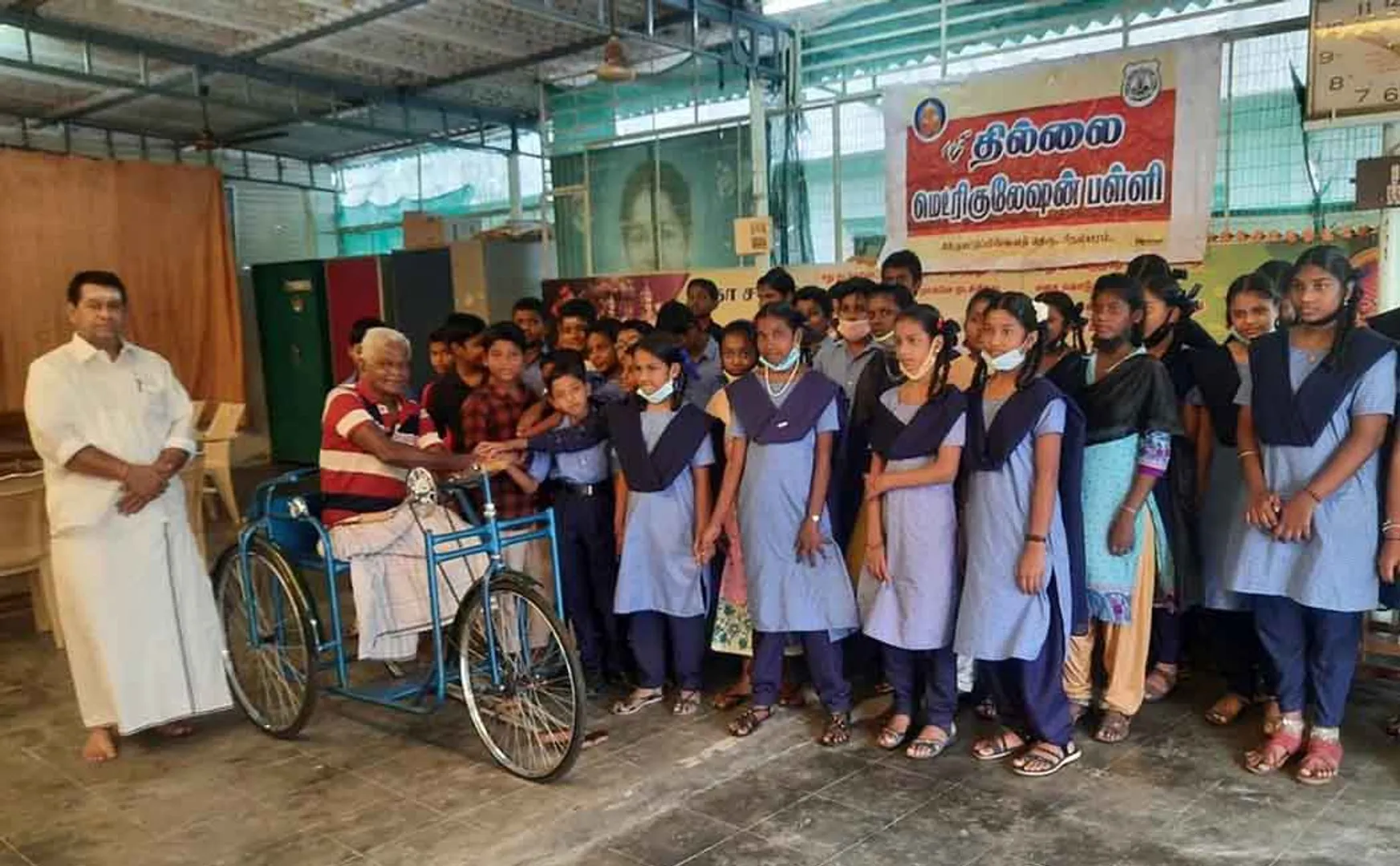 Students who bought a tricycle for a disabled old man!