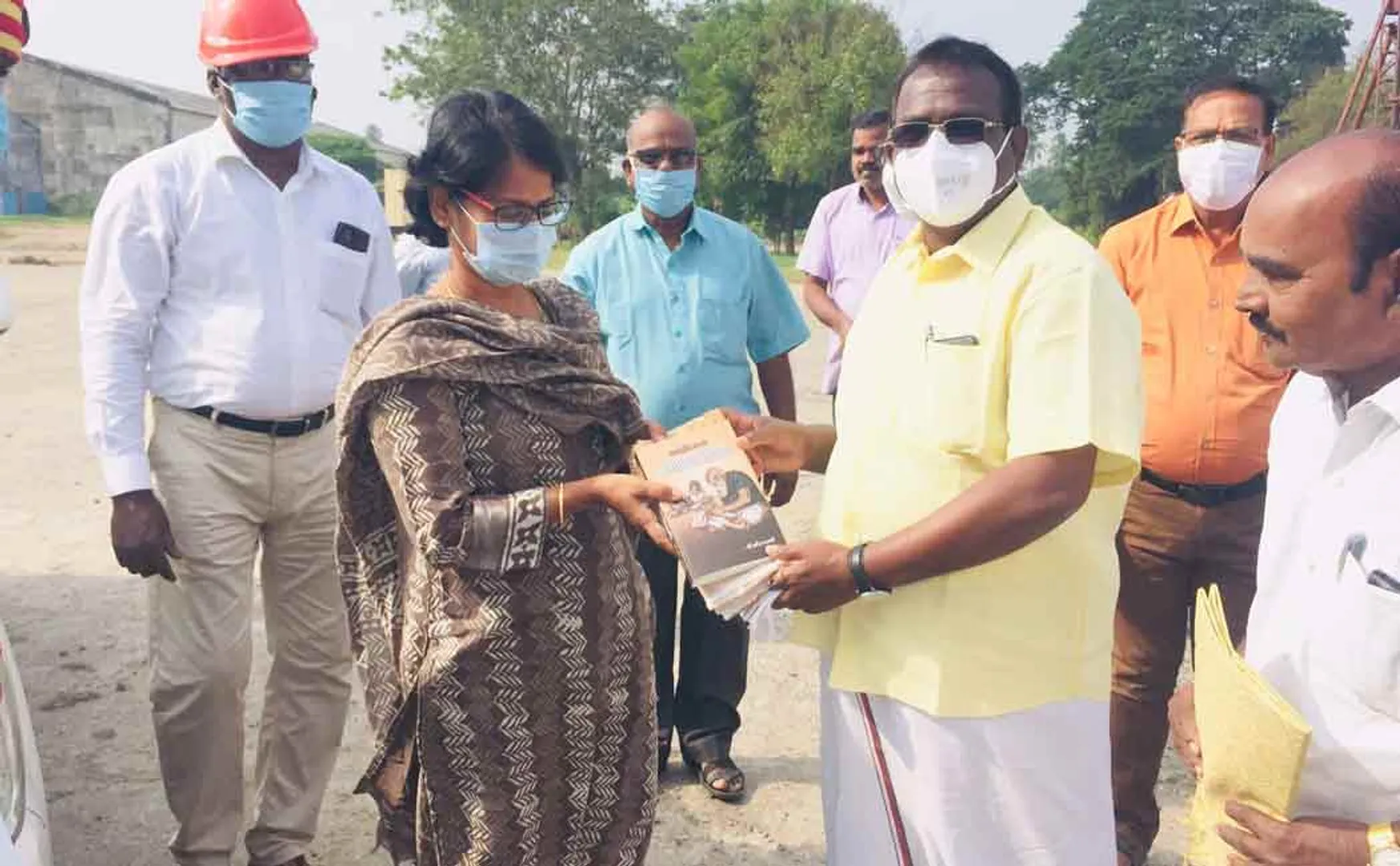District Collector starts sugarcane crushing