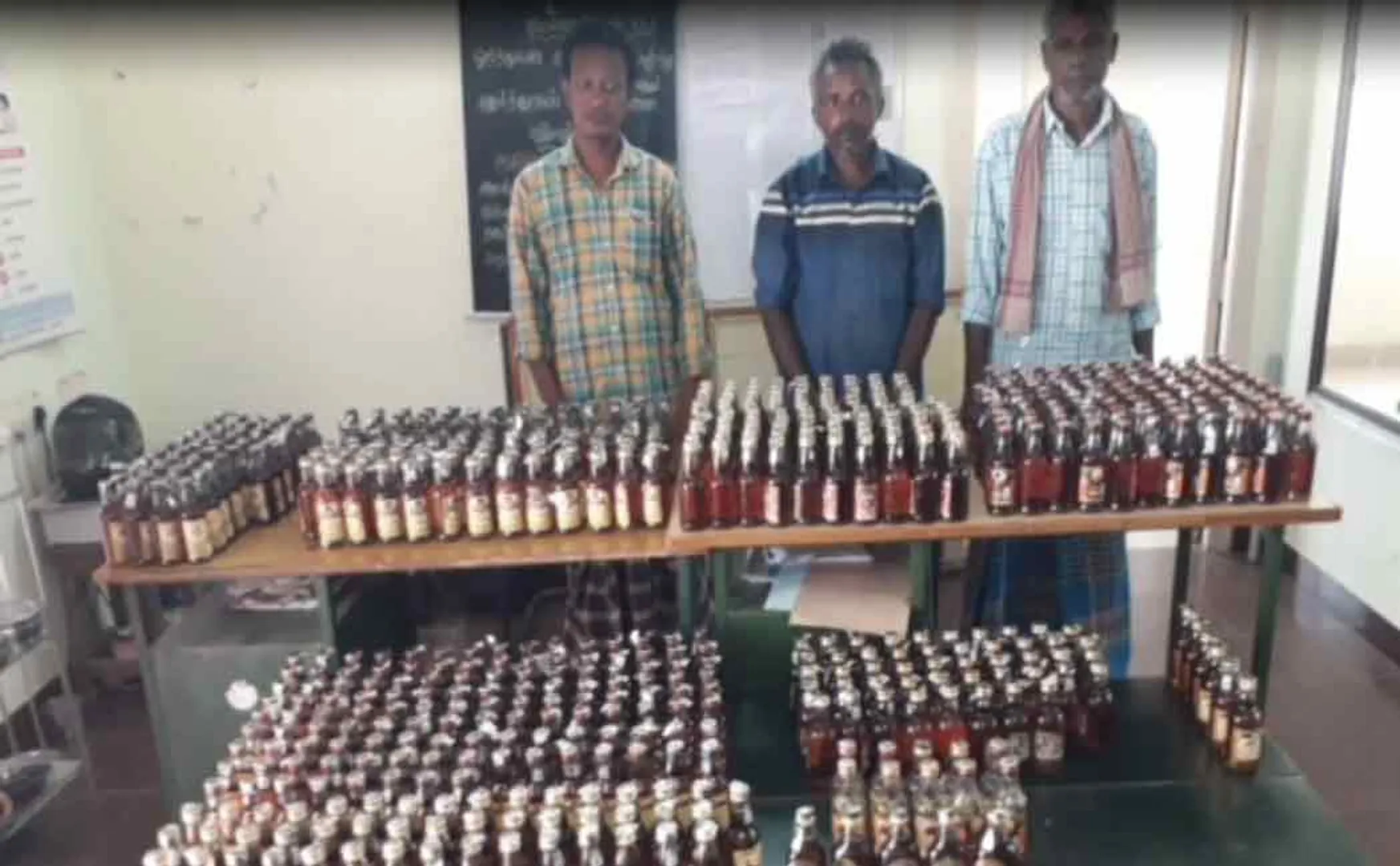 The trio were caught by police with 600 bottles of liquor