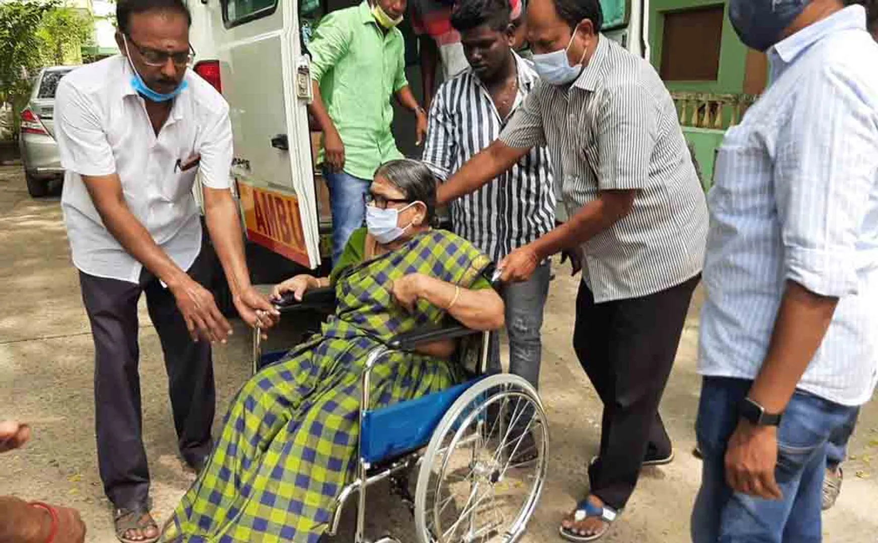 The old woman who came in the ambulance and voted!