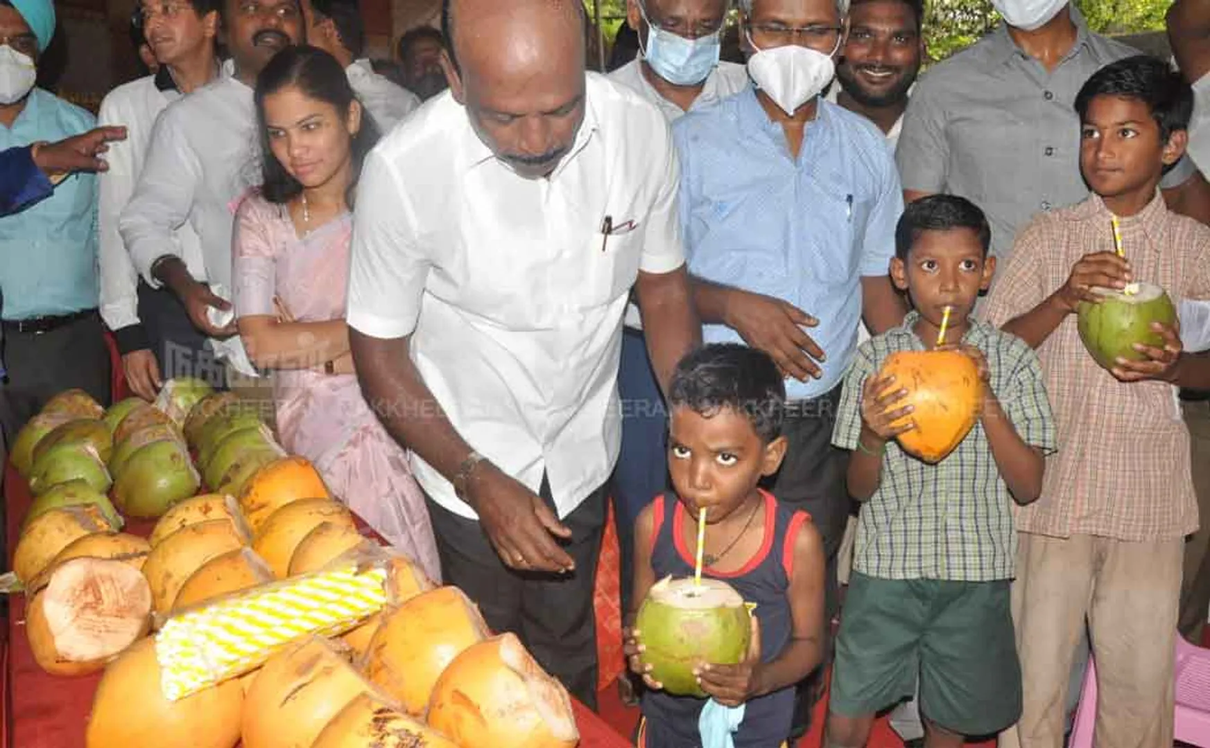 Minister Ma Subramanian giving Elanir  to students  