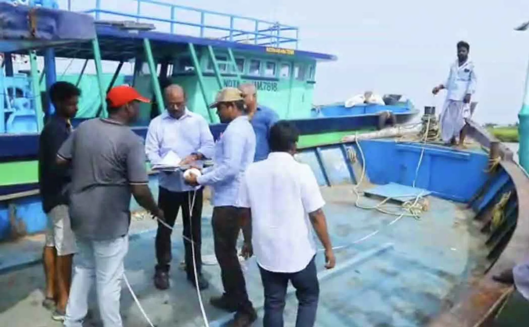 Fisheries officials inspecting boats 