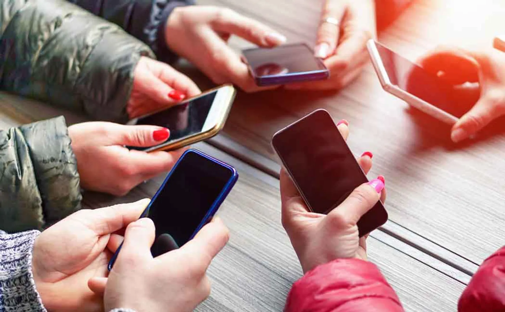 Students stuck with cellphones 