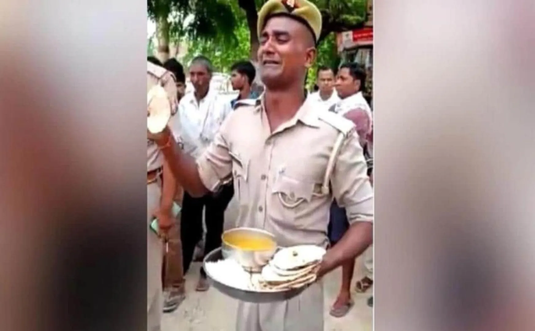 The policeman cried tears with a plate of food on the road!