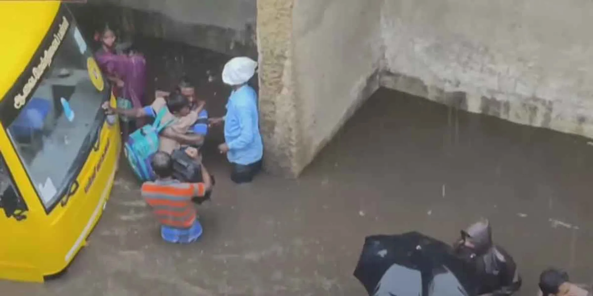 School bus stuck in rain flood...!