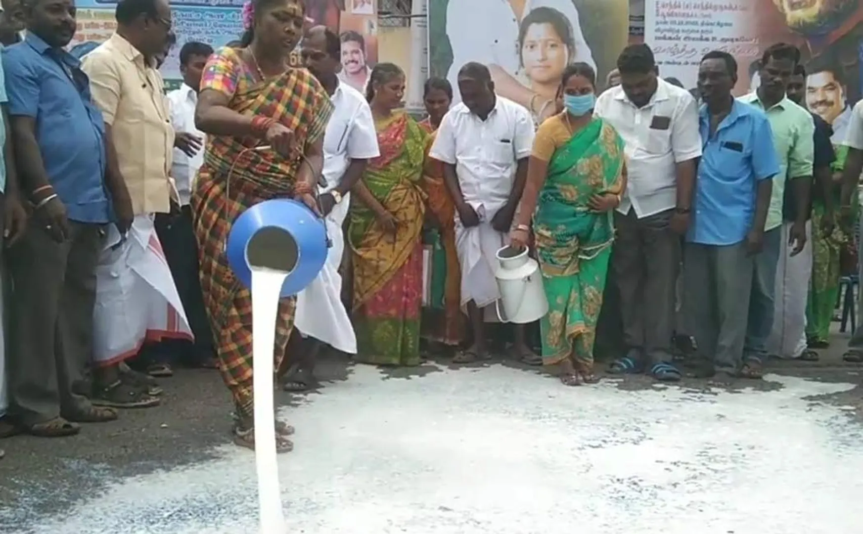 Demonstration pouring milk on road demanding increase milk procurement Puducherry