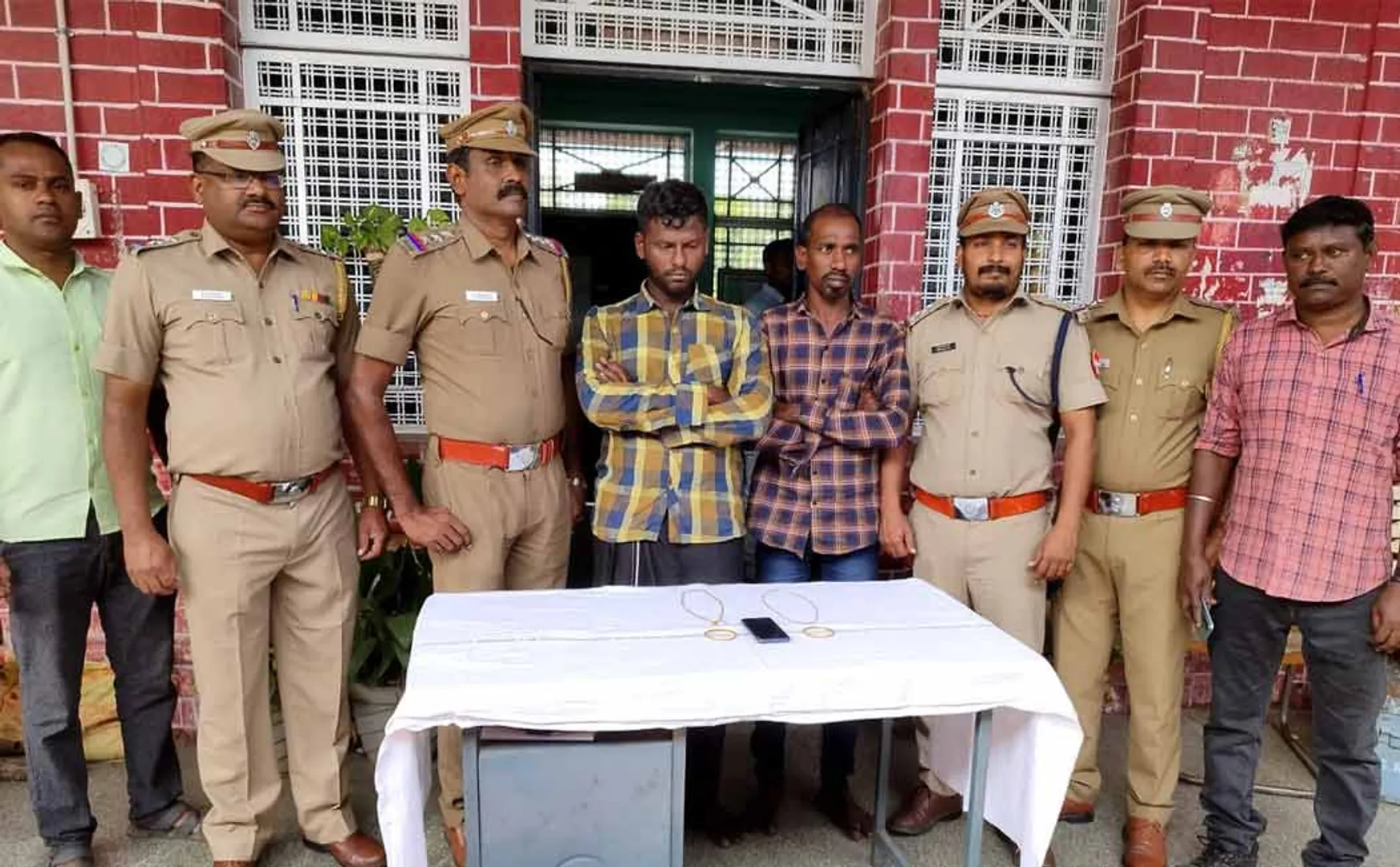 Two arrested for stealing old woman's bag from a moving train