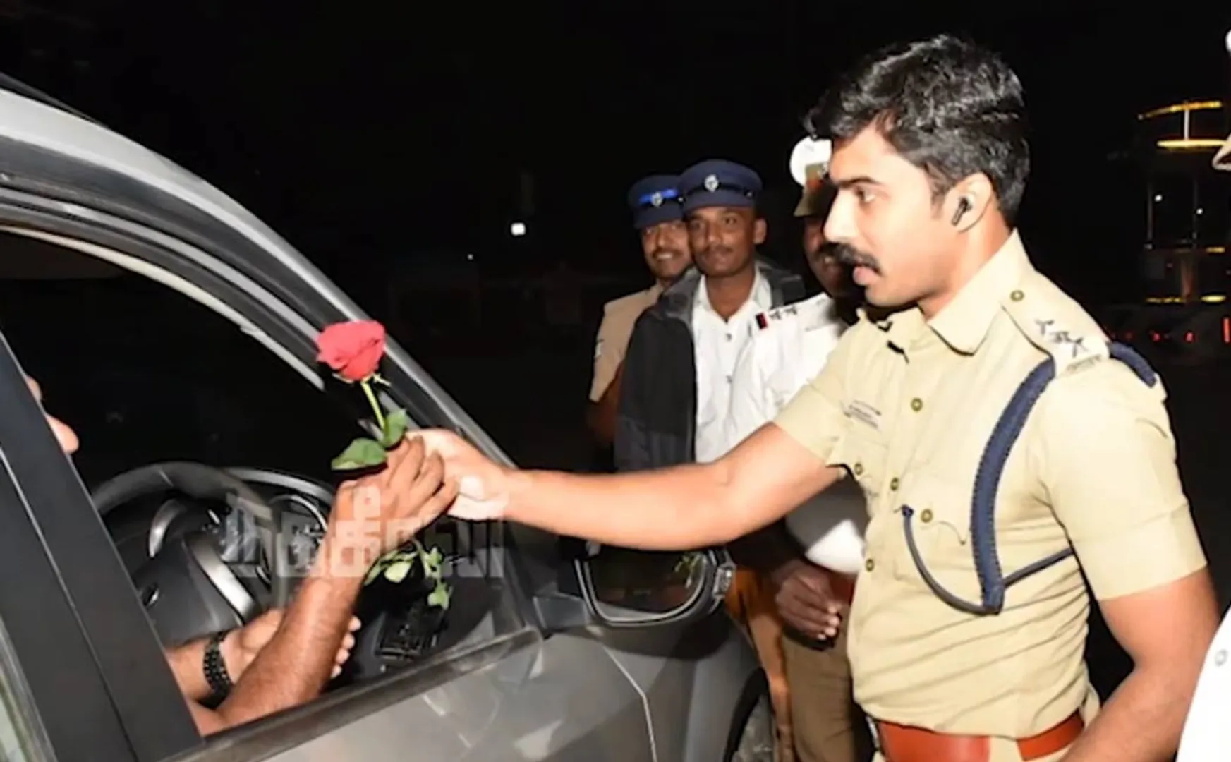 police gave flowers motorists who followed signal night time 