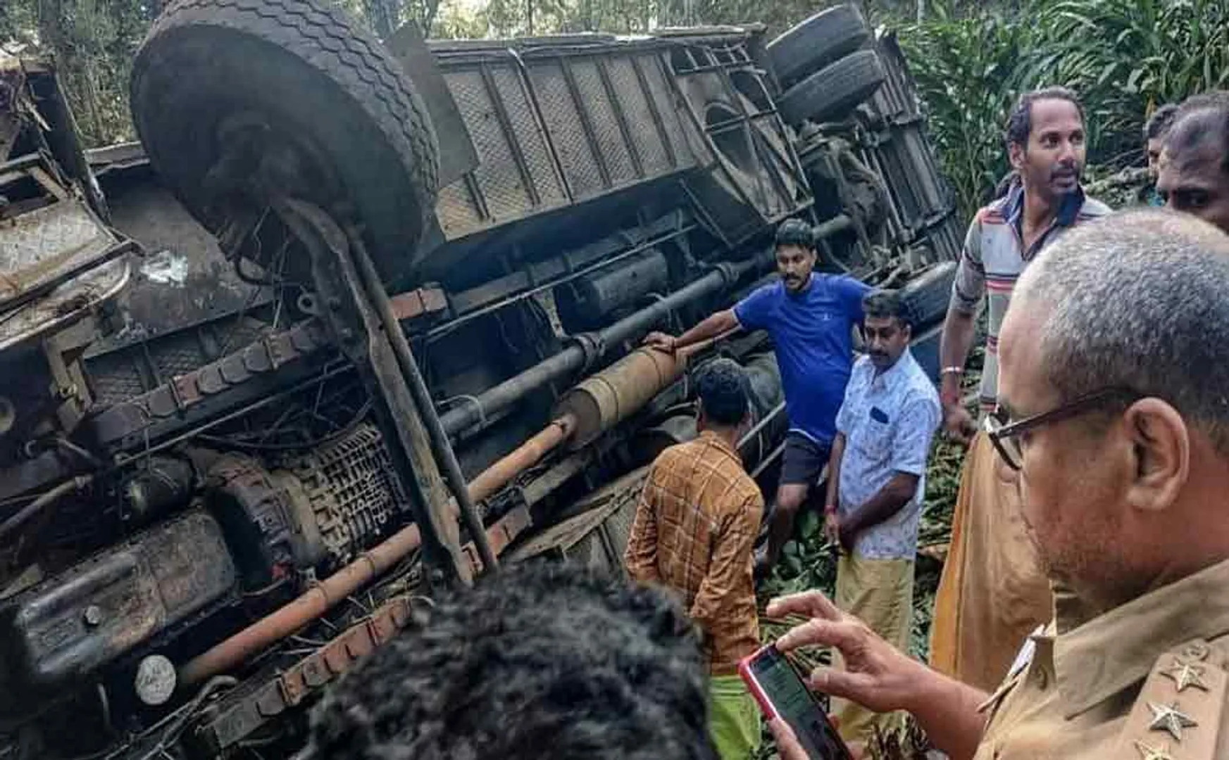 A college bus overturned in a 40-foot ditch; Student dies after being trapped under the bus