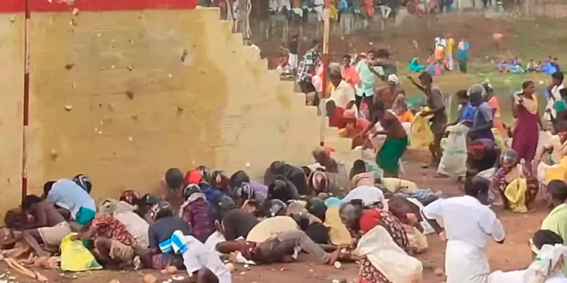 Five lakh neatly broken coconuts - helmeted people