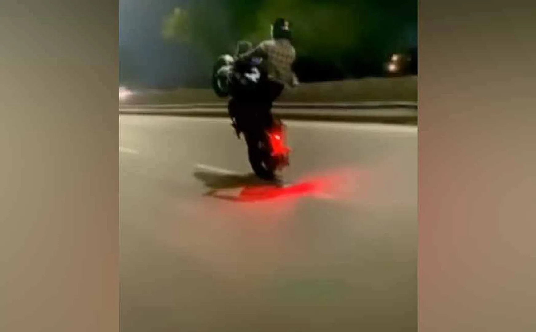 Youth wheeling like fireworks on bikes
