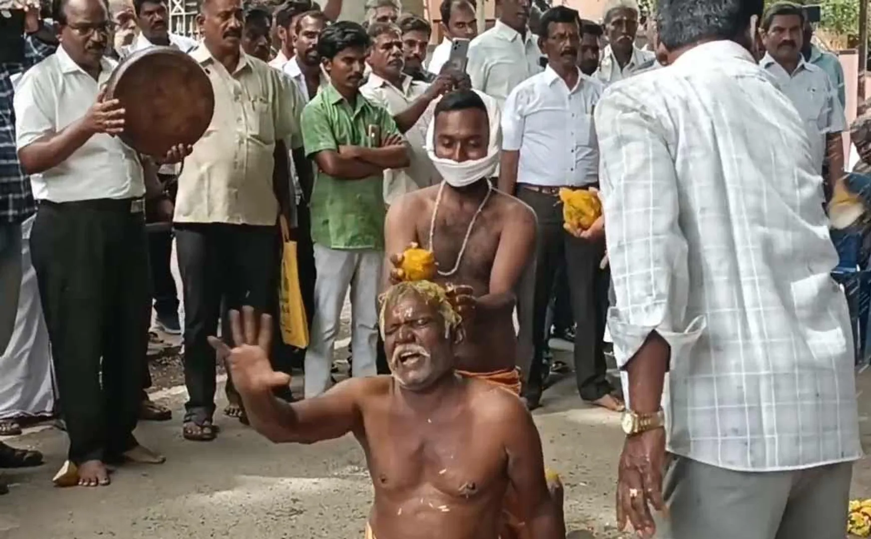 struggle demanding tribal certificate by breaking coconut on head