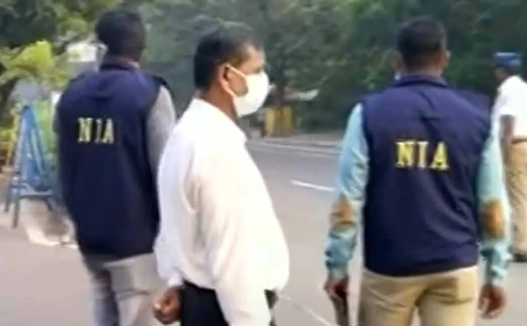  NIA officials inspect in front of Guindy Governor House