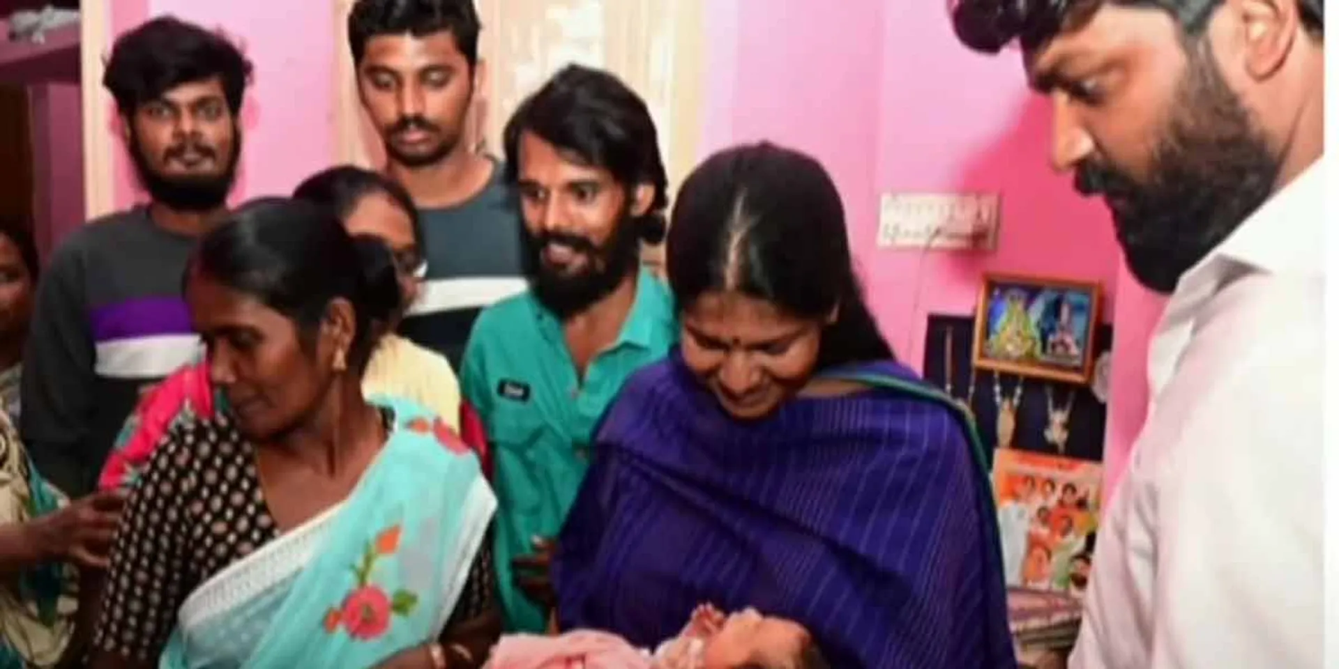 A child born to a woman who survived the flood; Kanimozhi fulfilled the wish of the family